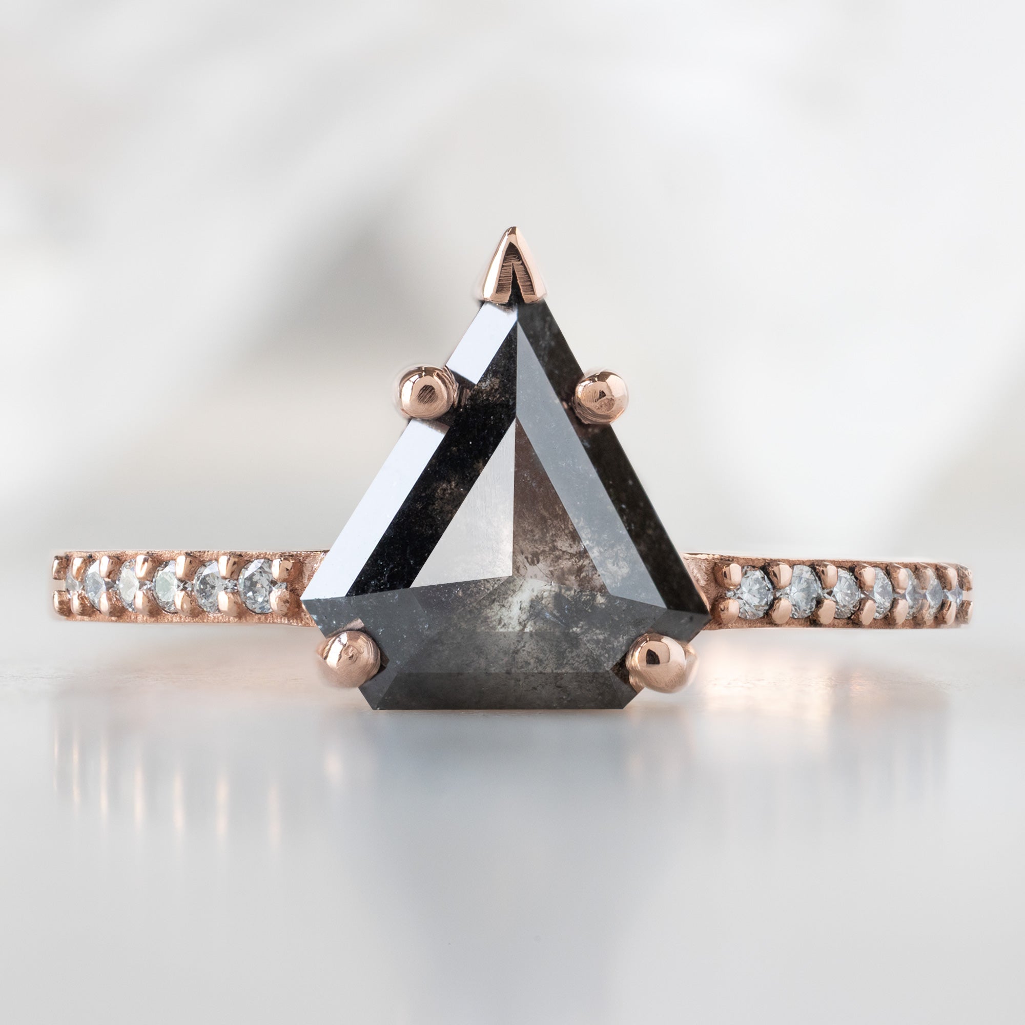 The Willow Ring with a 1.19ct Shield Black Diamond in 14K Rose Gold on White Marble