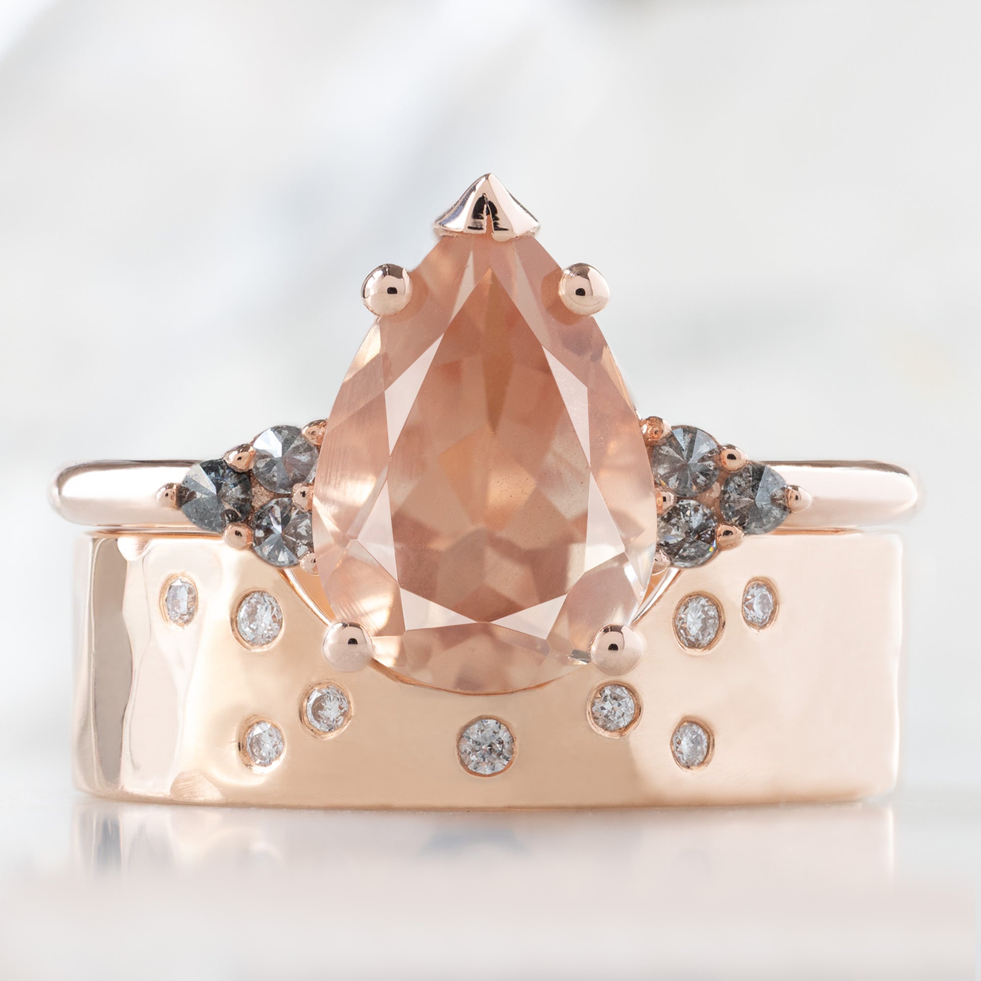 The Ivy Ring with a 1.89ct Pear Shaped Sunstone in 14K Rose Gold Stacked with the Constellation Arc Wedding Band