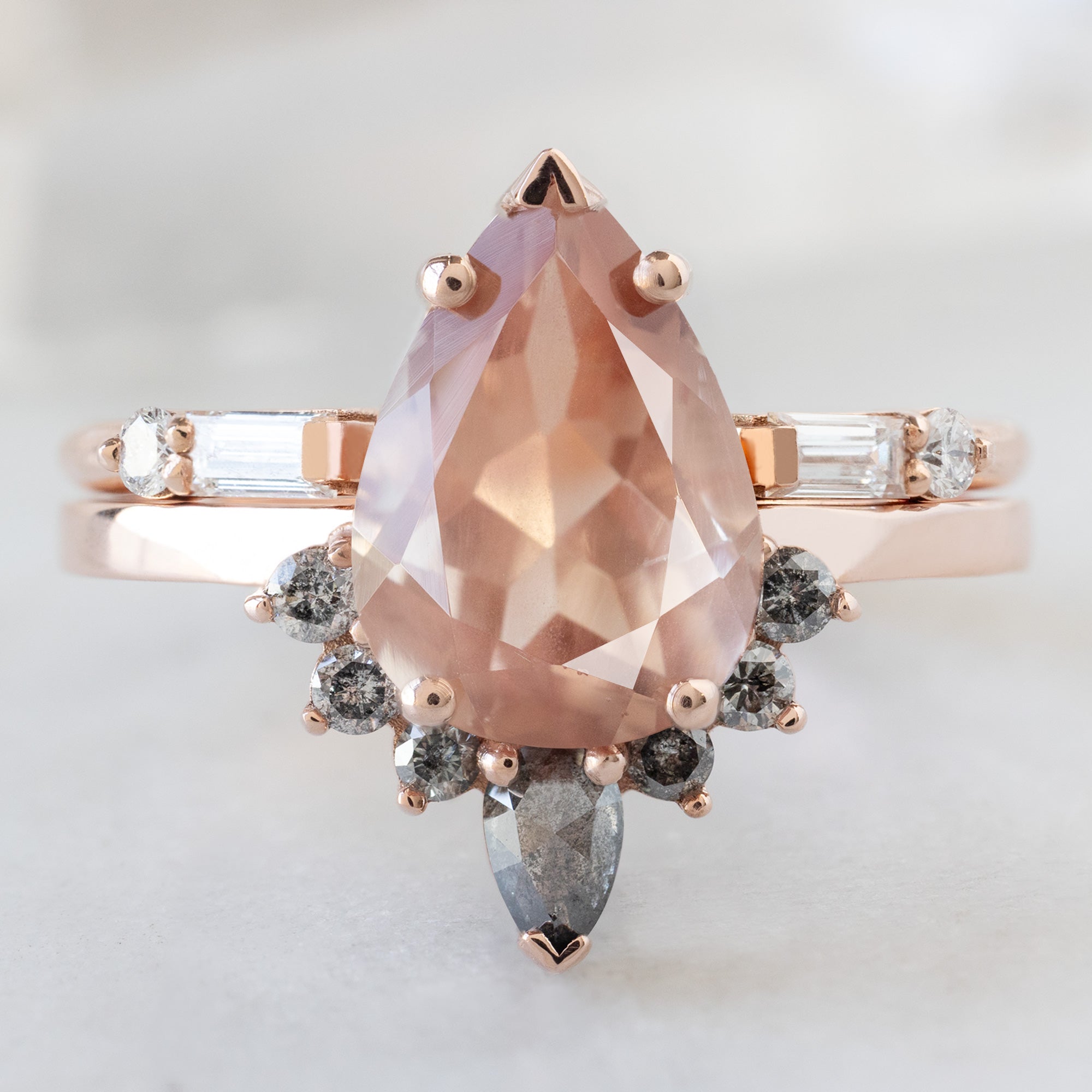 The Aster Ring with a 1.92ct Pear Sunstone in 14K Rose Gold  Stacked with the Open Cuff Luxe Baguette Diamond Stacking Band