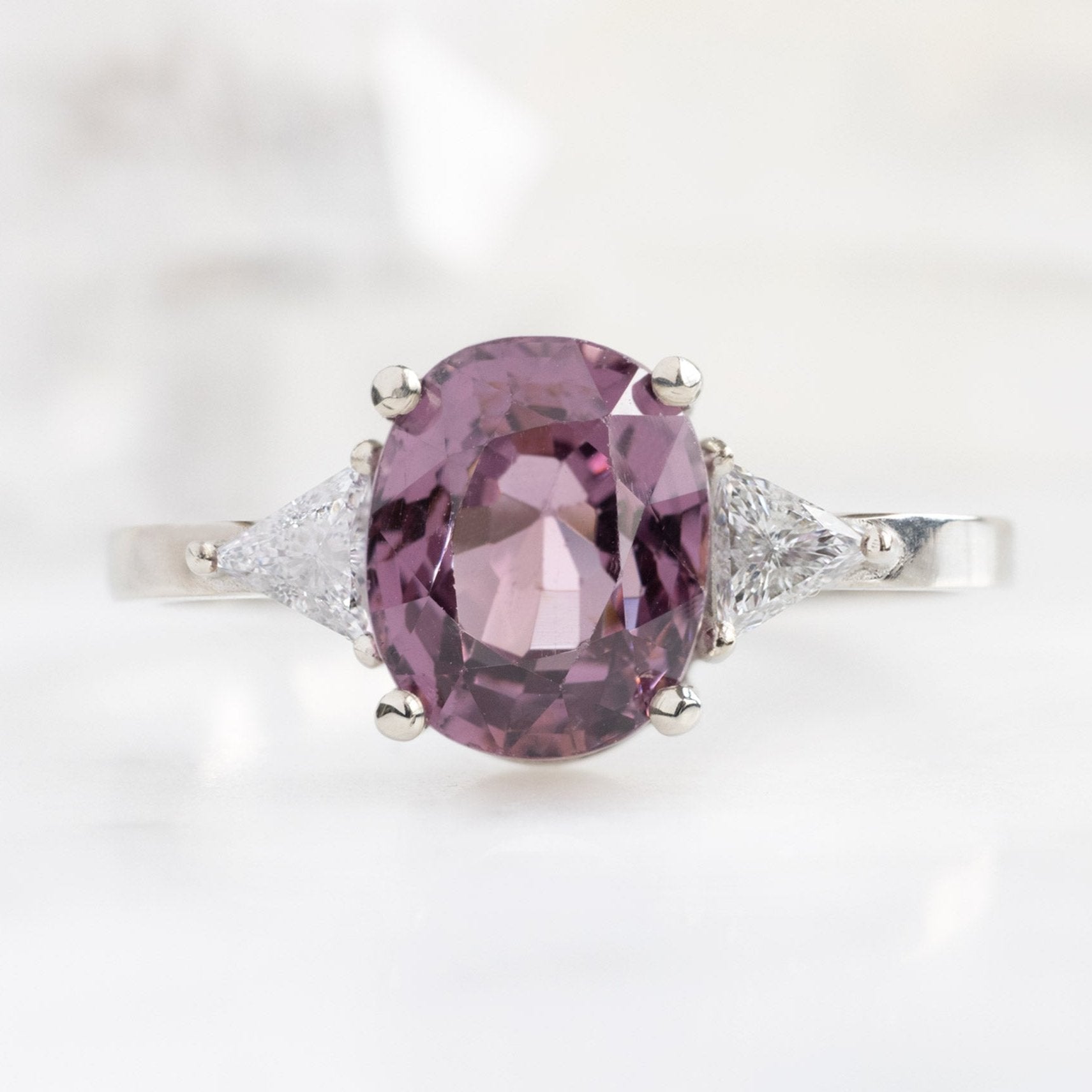 The Jade Ring with a 2.30ct Oval Magenta Spinel in 14K White Gold on White Marble