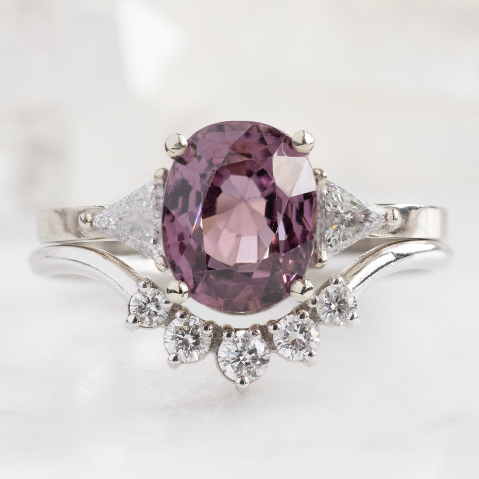 The Jade Ring with a 2.30ct Oval Magenta Spinel in 14K White Gold Stacked with the Round White Diamond Sunburst Stacking Band