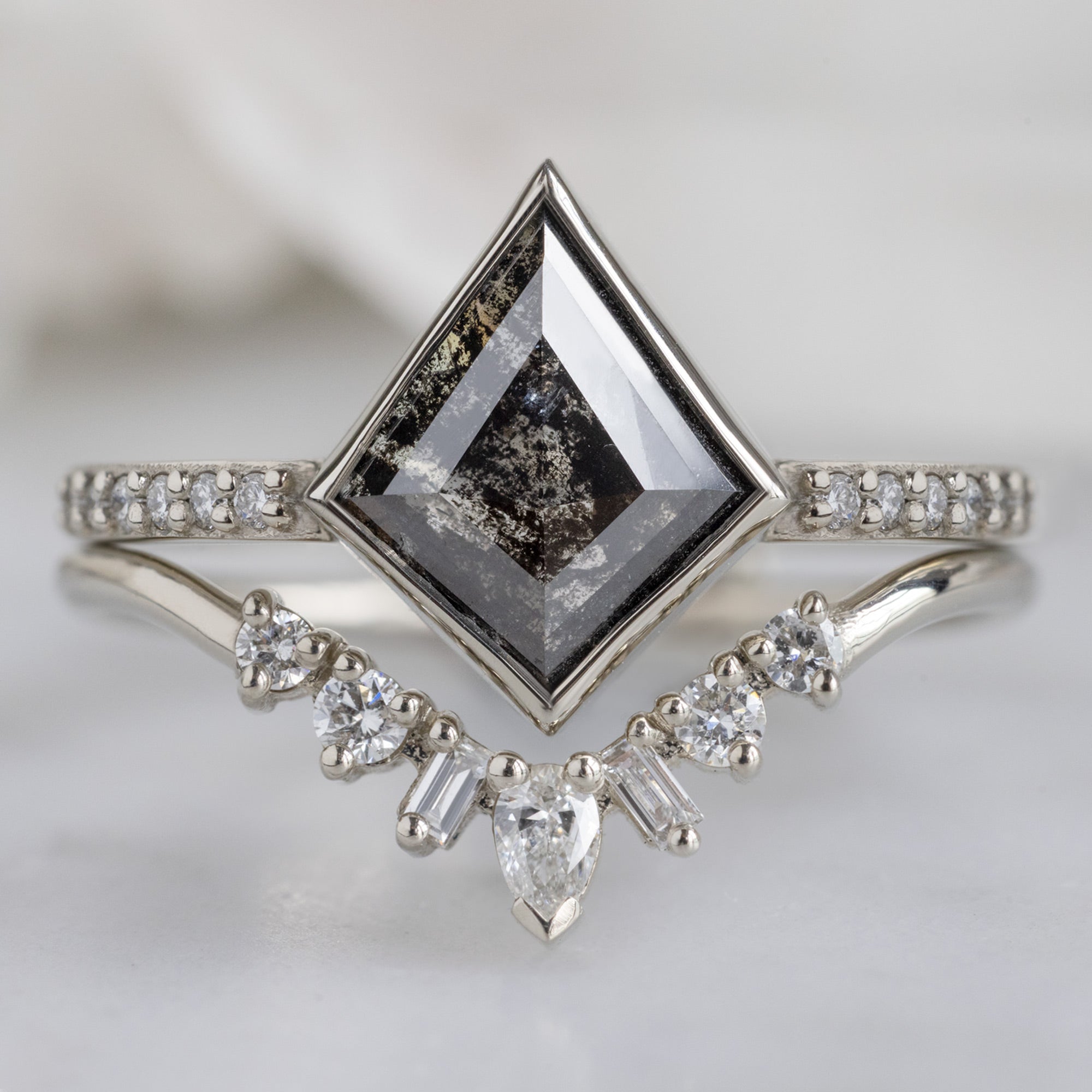 The Willow Ring with a 1.19ct Kite Black Diamond in 14K White Gold Stacked with the Geometric White Diamond Sunburst Stacking Band