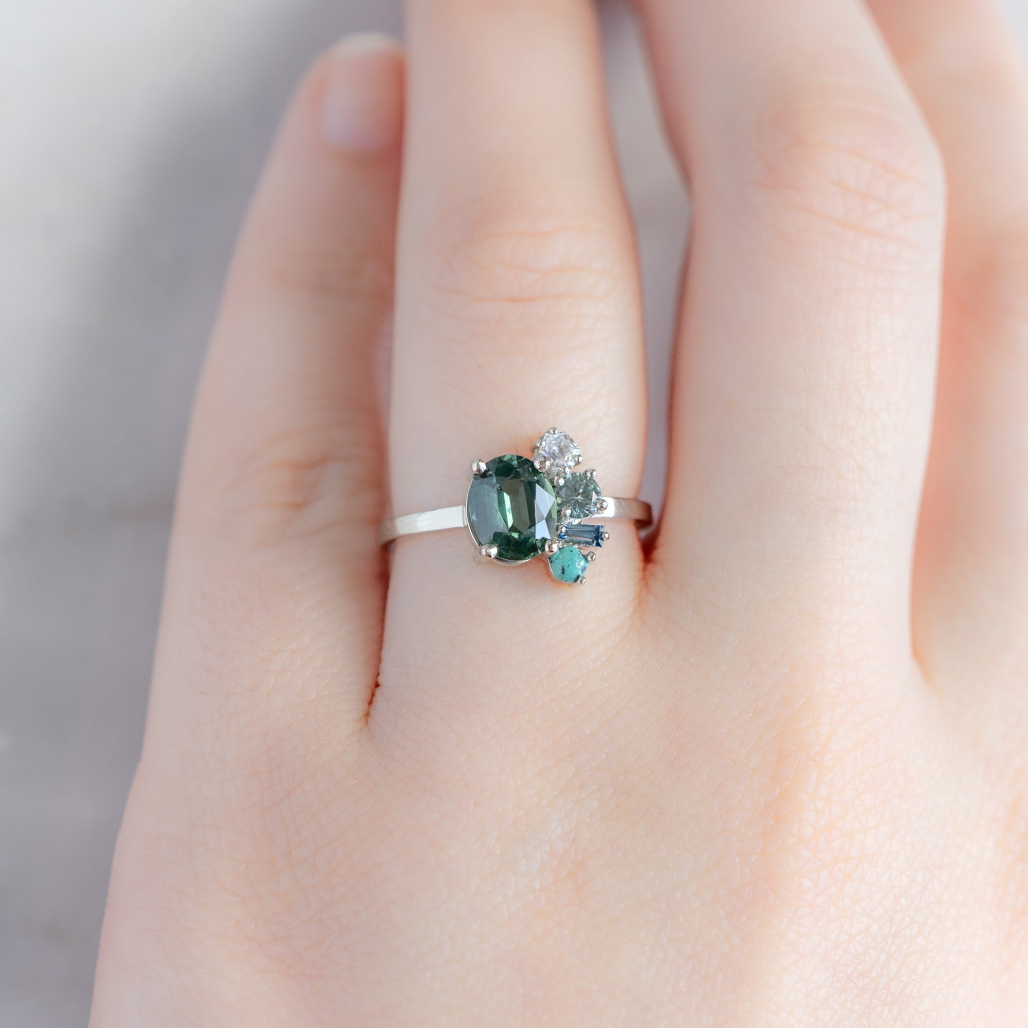 The Watercolor Cluster Ring with a 1.53ct Oval Green Sapphire in 14K White Gold on Model