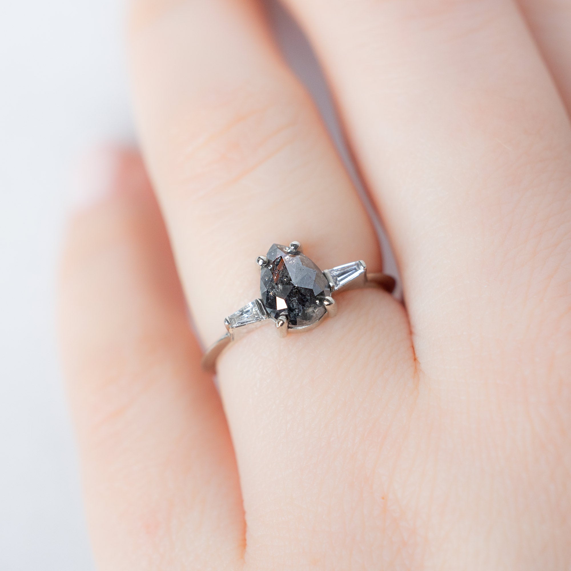 The Ash Ring with a 1.24ct Pear Black Diamond in 14K White Gold on Model