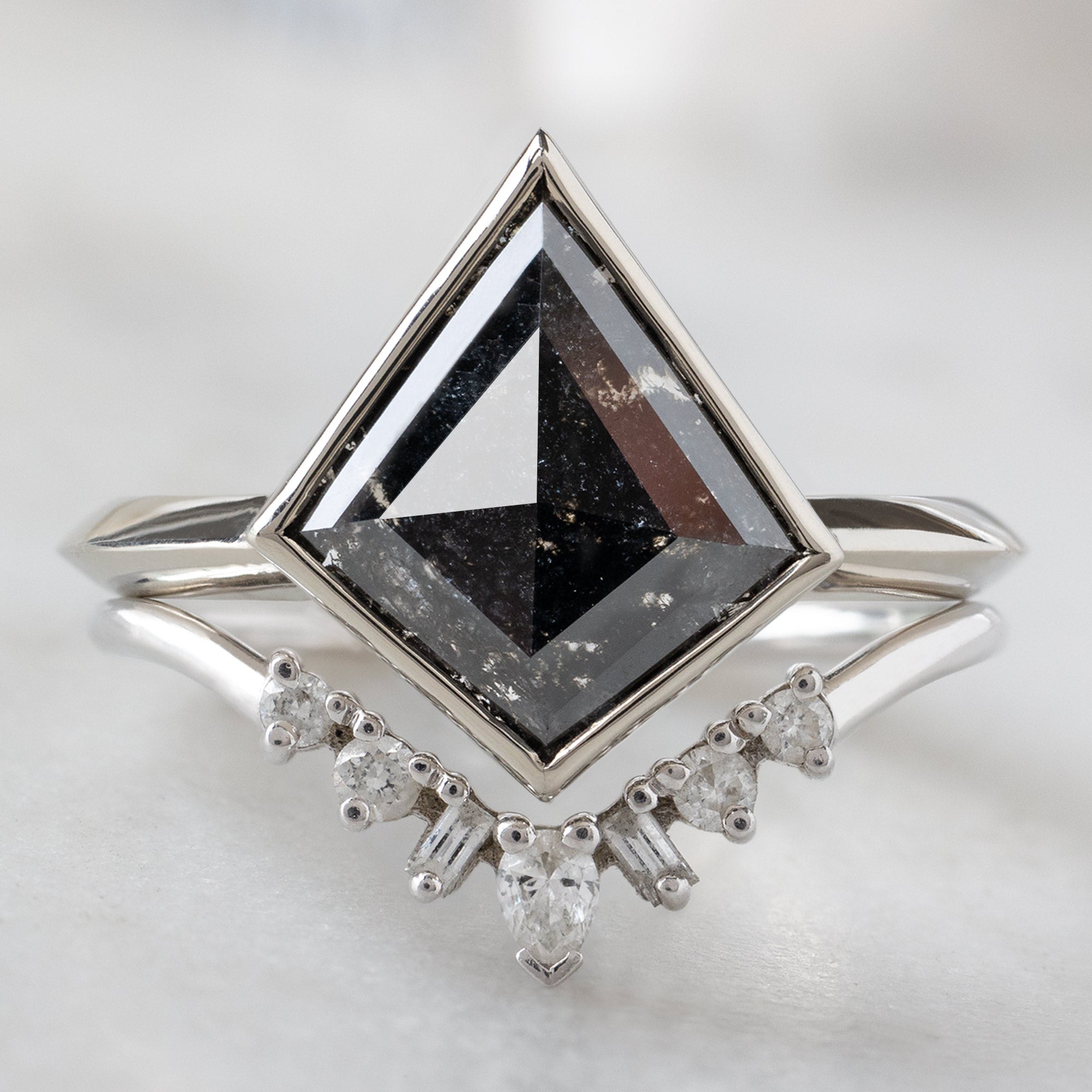 The Hazel Ring with a 1.97ct Kite Black Diamond in 14K White Gold Stacked with the Geometric White Diamond Sunburst Stacking Band
