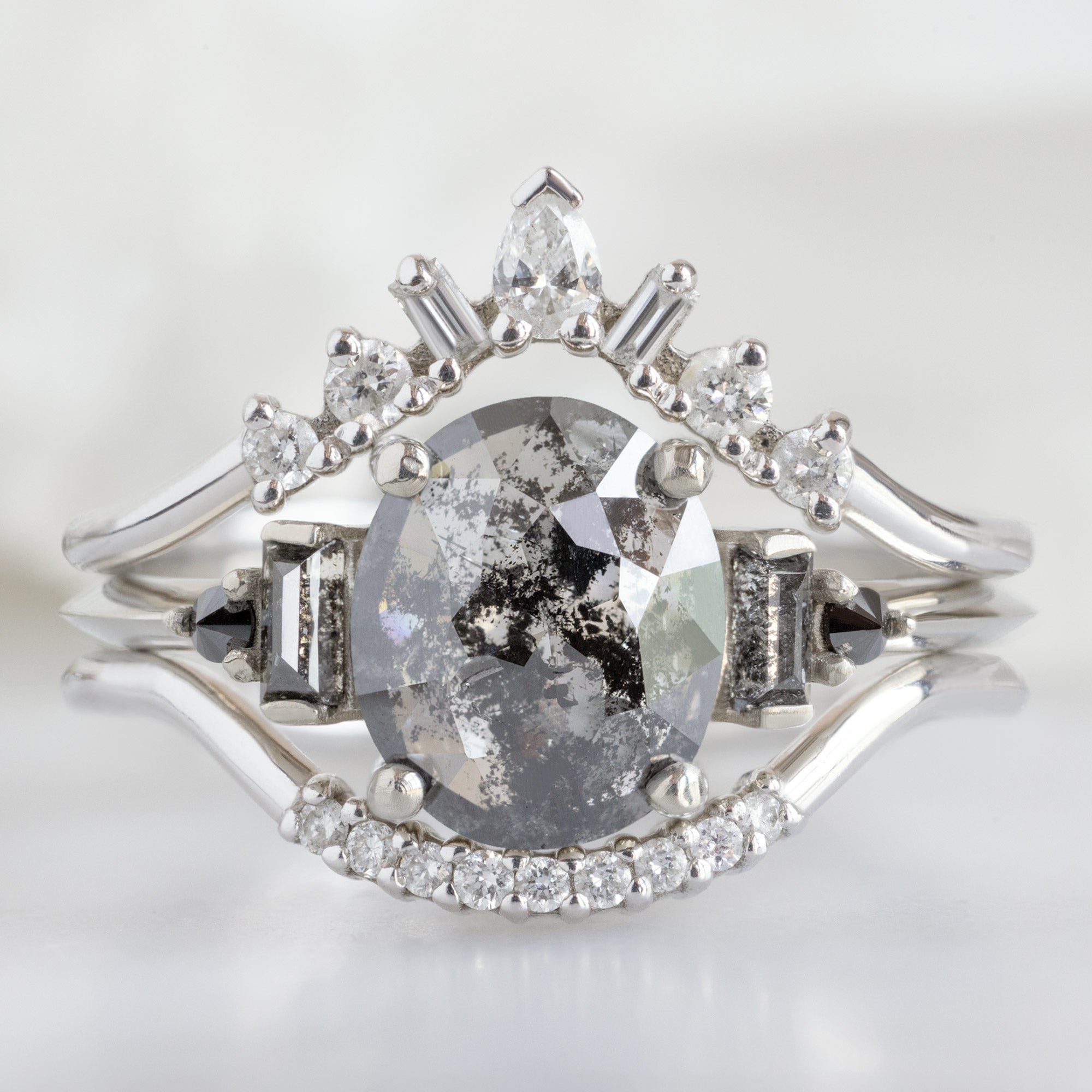 buy:geometric-white-diamond-sunburst-stacking-band-14k-or-18k-yellow-gold,the-primrose-ring-1-32ct-oval-salt-and-pepper-diamond-in-14k-white-gold,white-diamond-pave-arc-stacking-band-14k-or-18k-yellow-gold