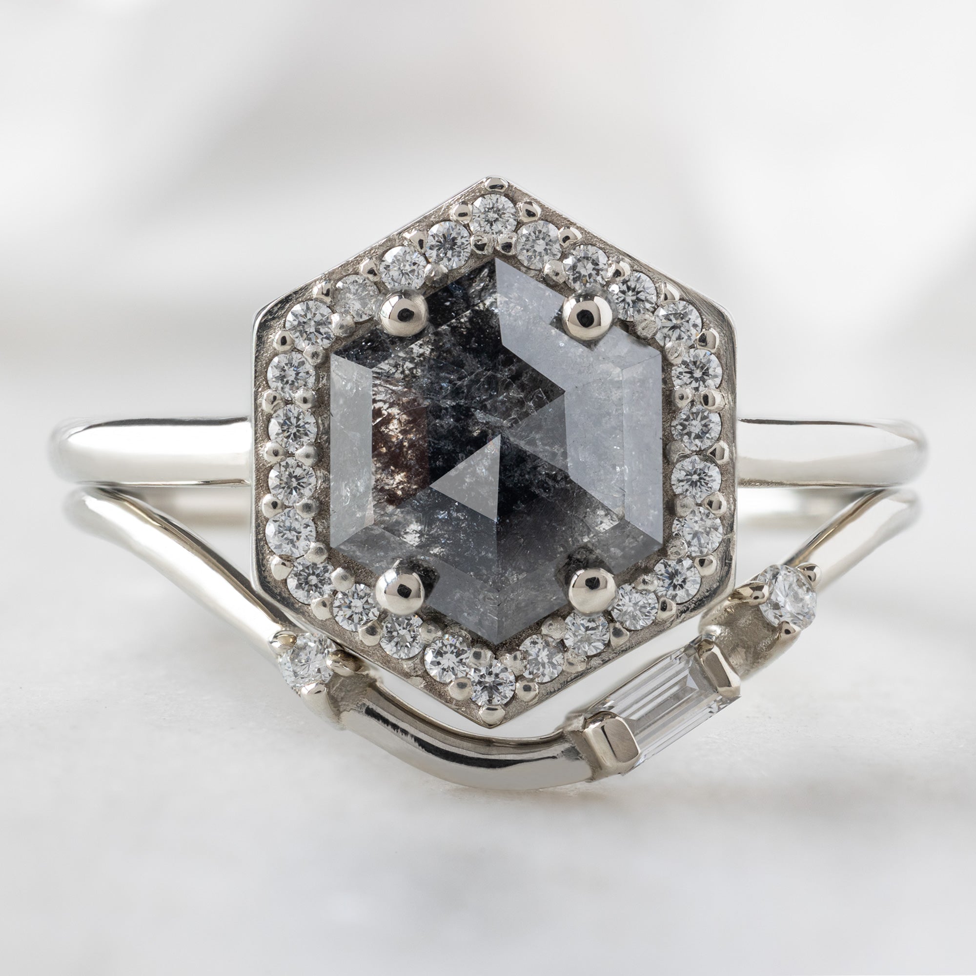 The Dahlia Ring with a 1.08ct Hexagon Black Diamond in 14K White Gold  Stacked with the Asymmetrical Baguette Arc Stacking Band on White Background