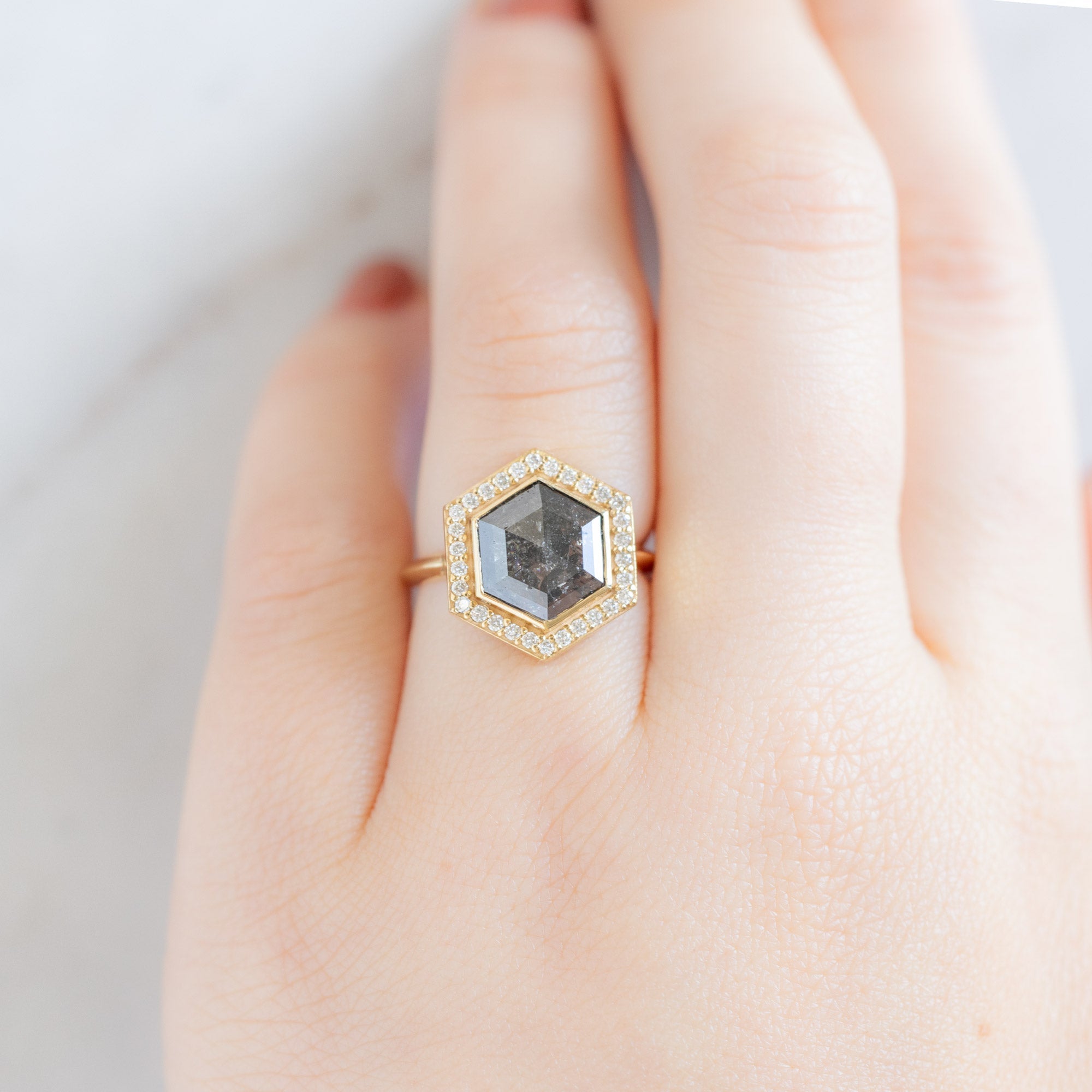 The Dahlia Luxe with a 2.68ct Salt and Pepper Hexagon Diamond in 18K Yellow Gold on Model