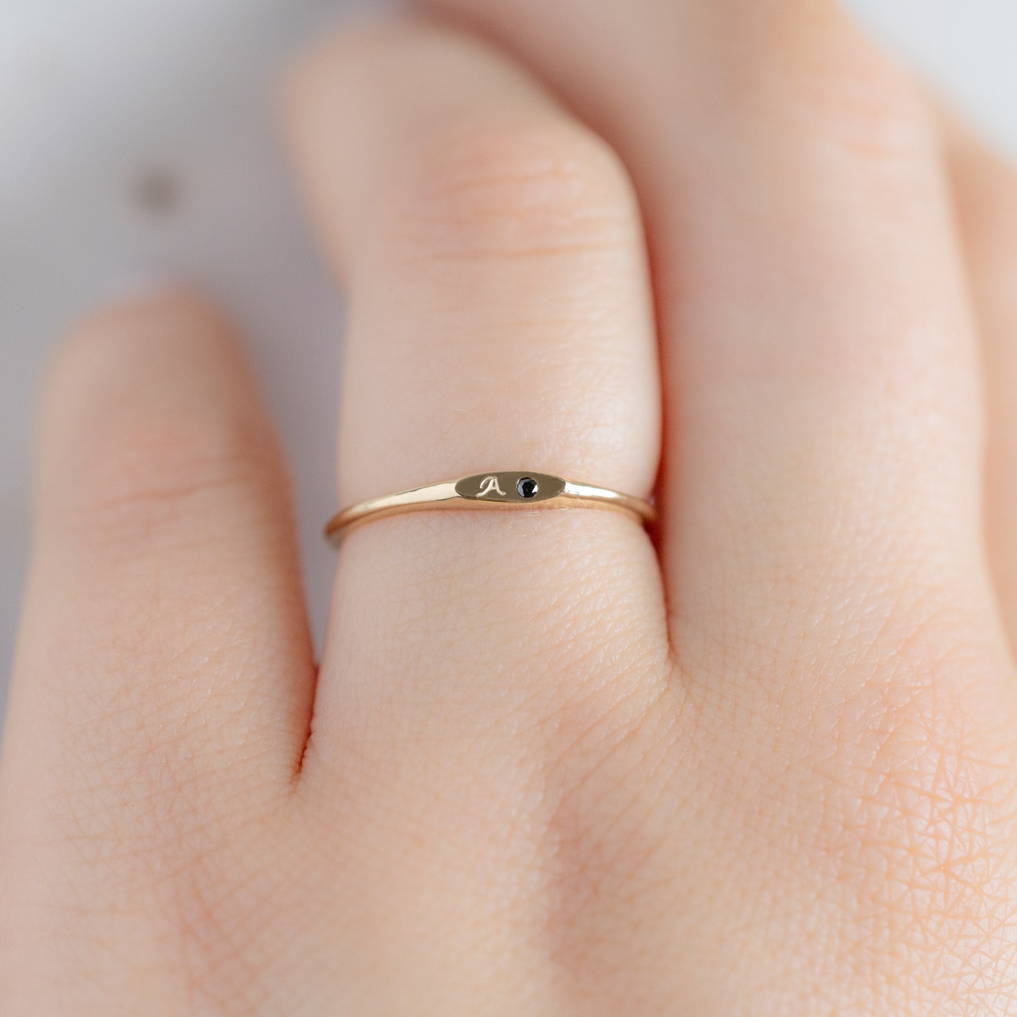 The Teensy Black Diamond Signet Ring in 10K Yellow Gold on Model
