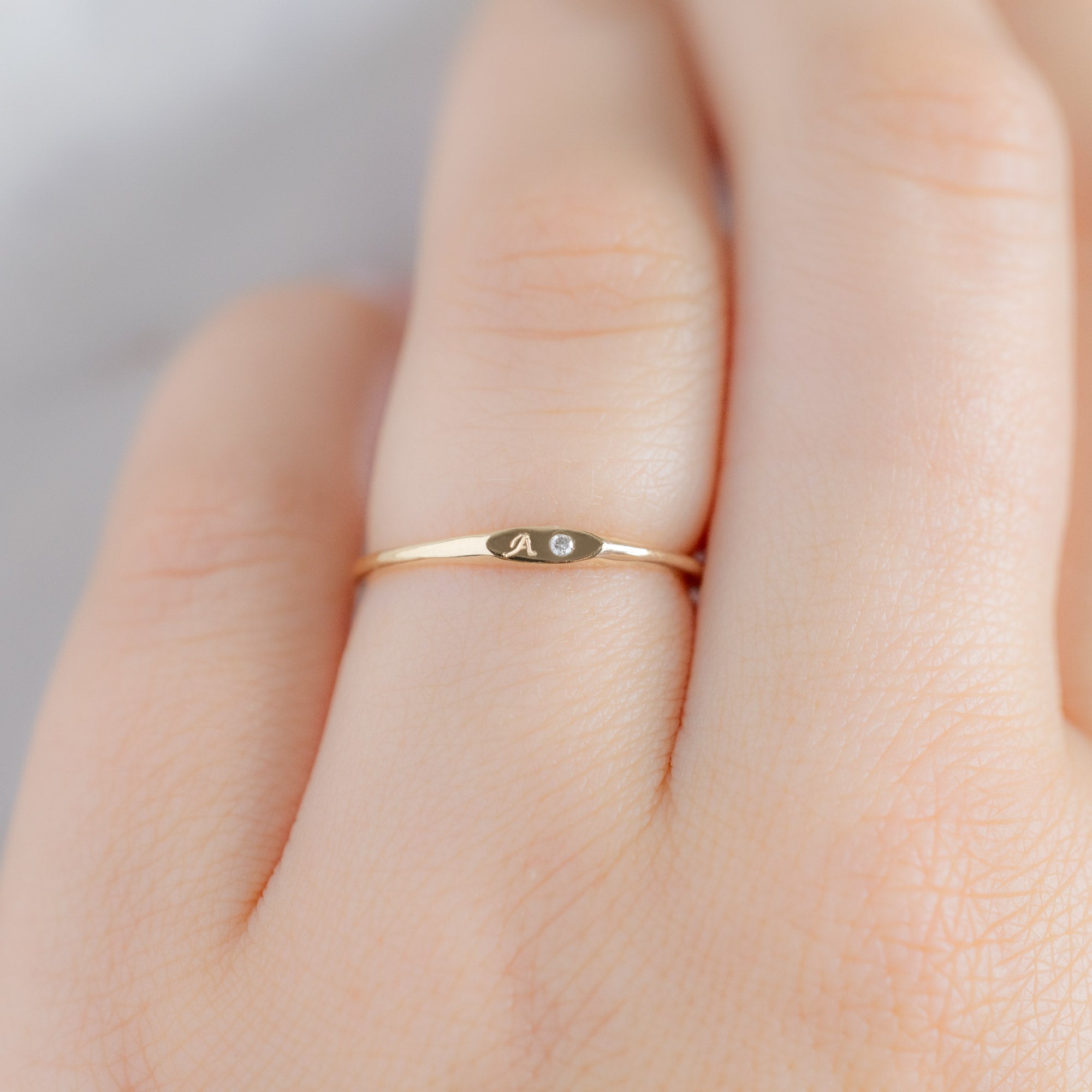 The Teensy White Diamond Signet Ring in 10K Yellow Gold on Model