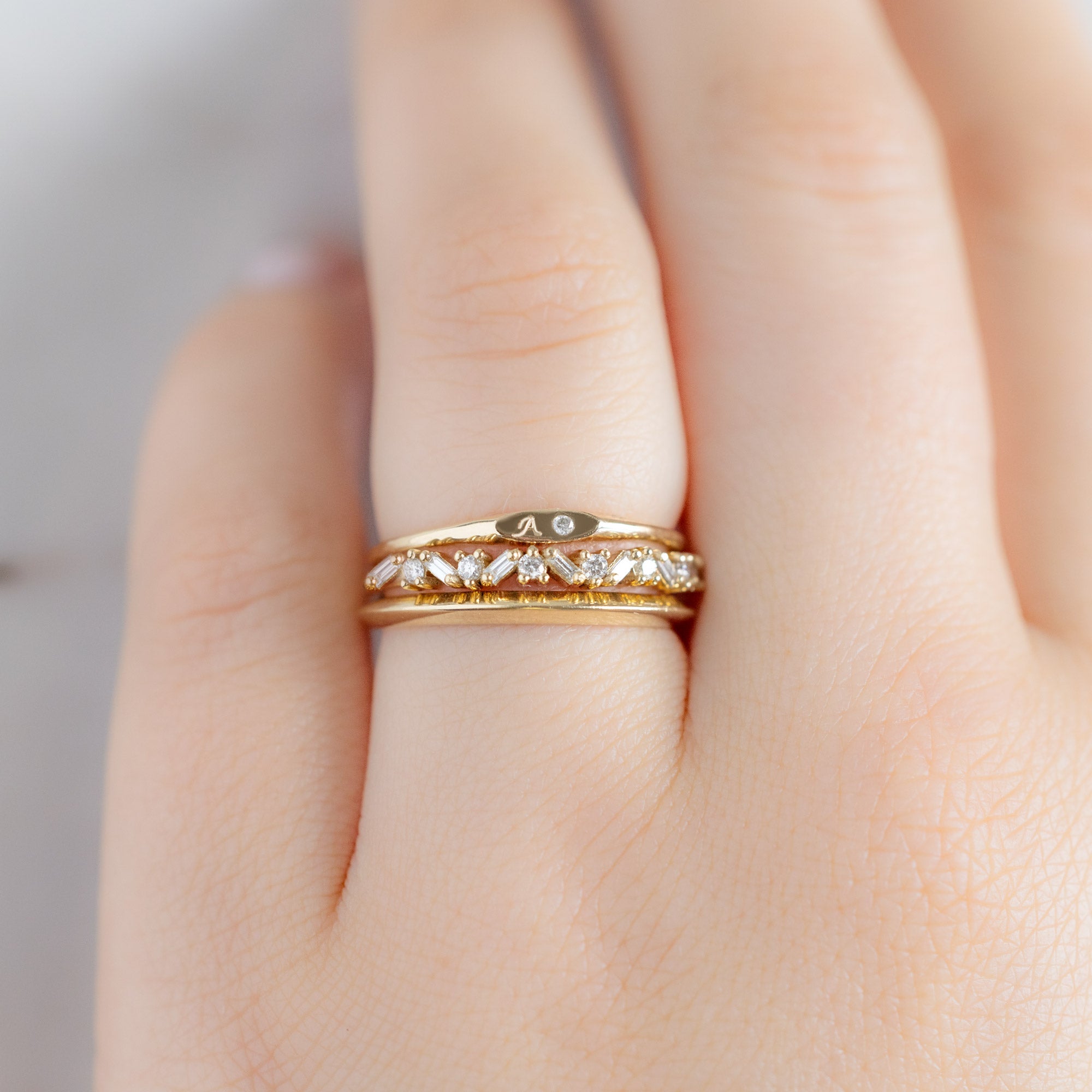buy:the-teensy-white-diamond-signet-ring-yellow-gold,the-baguette-confetti-stacking-ring-14k-or-18k-yellow-gold,the-unisex-gold-knife-edge-band-14k-yellow-gold