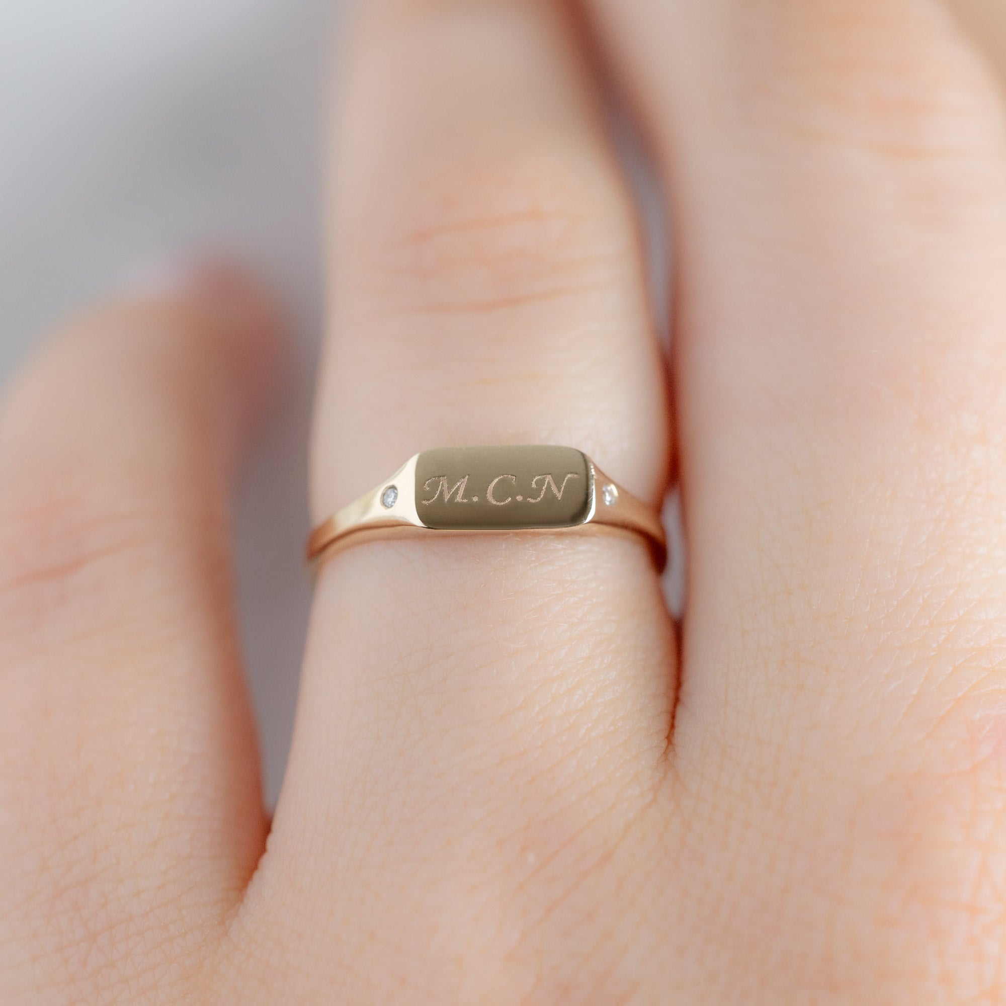 The Monogram Signet Ring in 10K Yellow Gold on Model