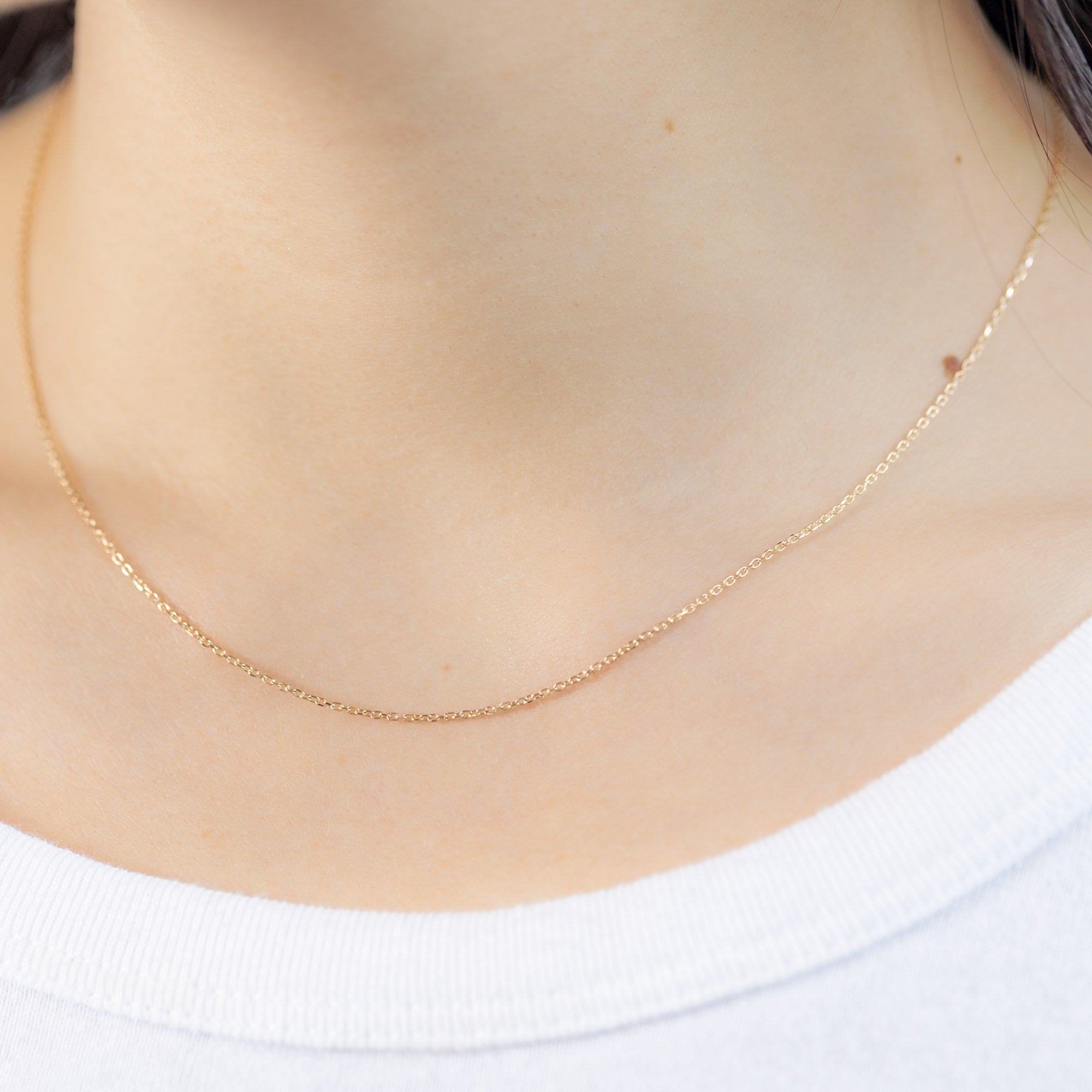 The Diamond-Cut Cable Chain Charm Necklace in 10K Yellow Gold on Model