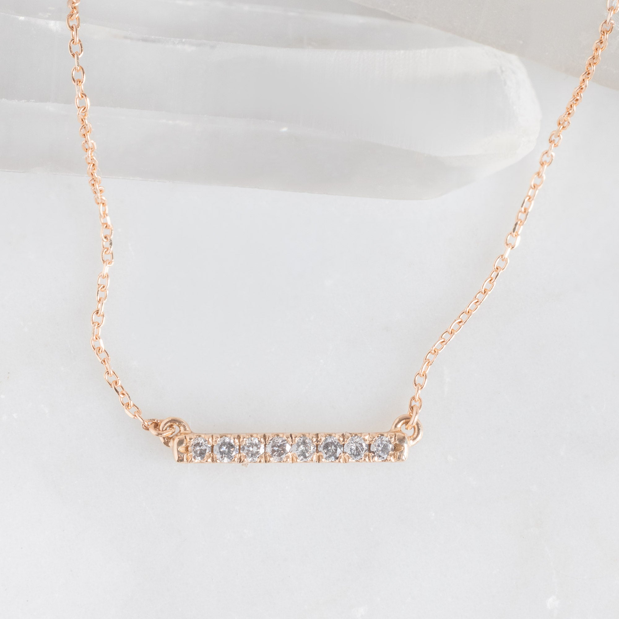 The Salt and Pepper Diamond Bar Necklace in Rose Gold on White Marble