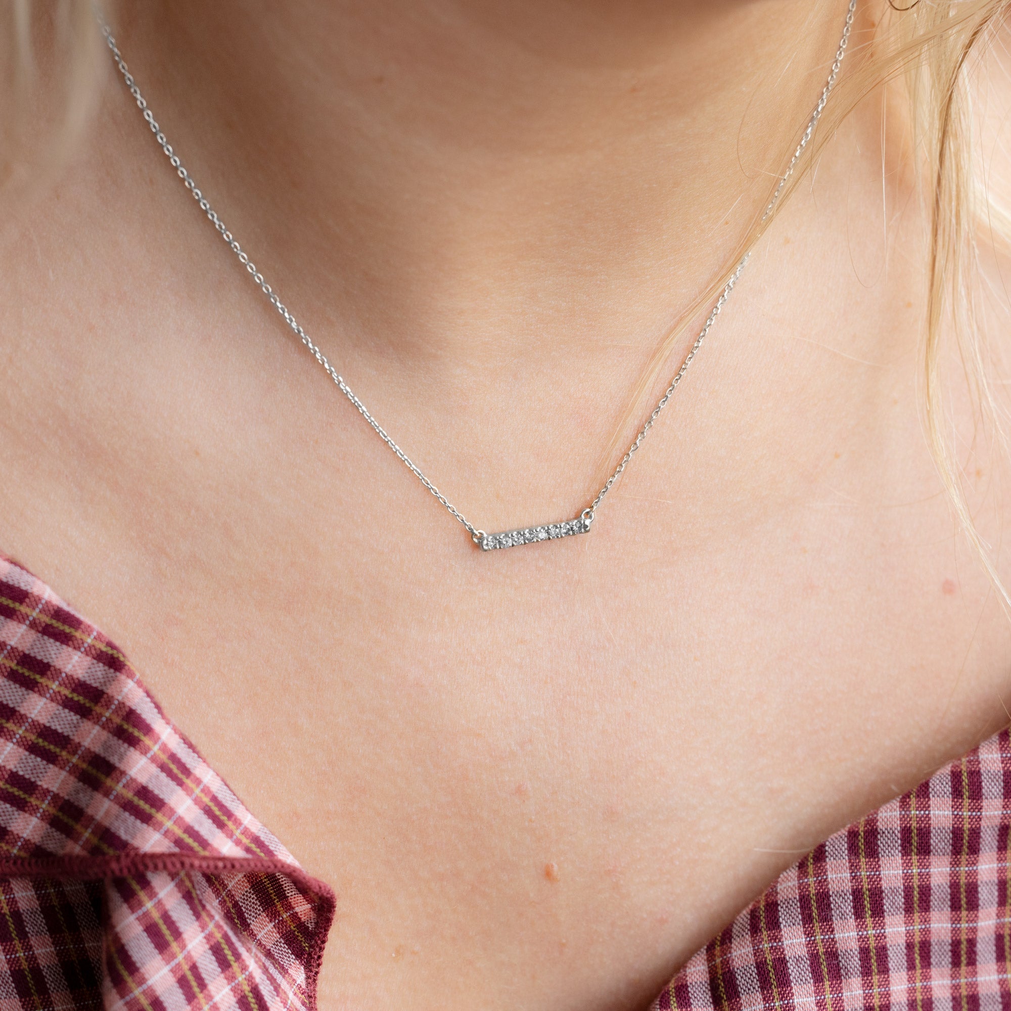 The Salt and Pepper Diamond Bar Necklace in White Gold on Model in Red Checkered Shirt