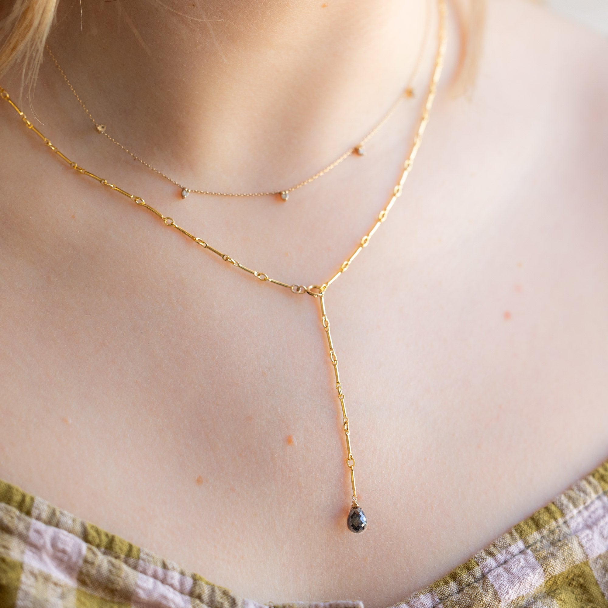 buy:the-diamond-sunburst-necklace-10k-yellow-gold,the-bar-chain-briolette-black-diamond-lariat-necklace-gold-filled