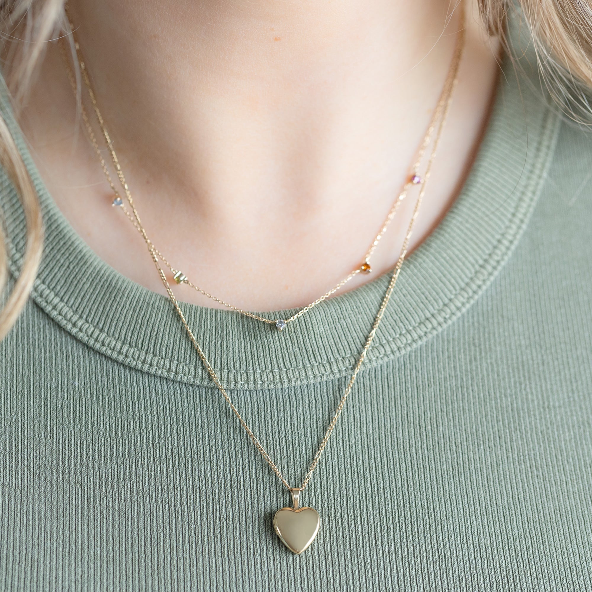 The Yellow Mini Sweetheart Locket Necklace in Yellow Gold layered on model