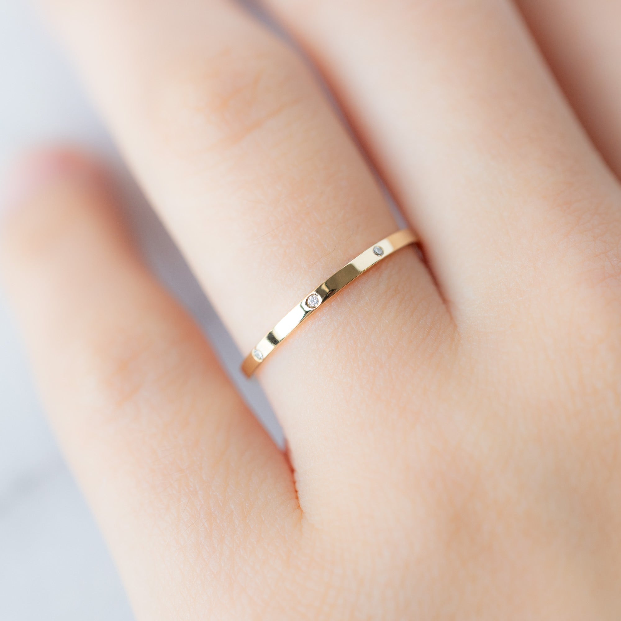 White Diamond Eternity Band in 14K Yellow Gold on Model