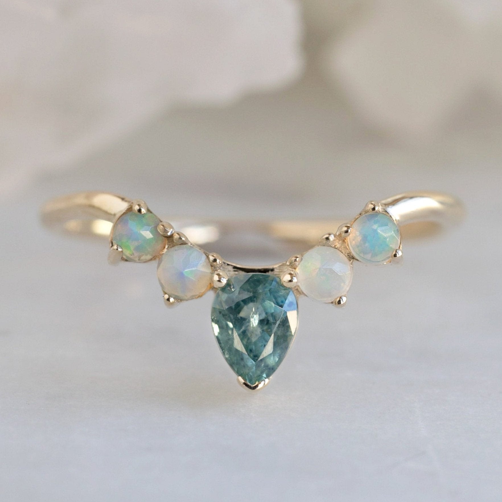 One of a Kind Montana Sapphire + Opal Sunburst Stacking Band in Yellow Gold on White Marble Tile