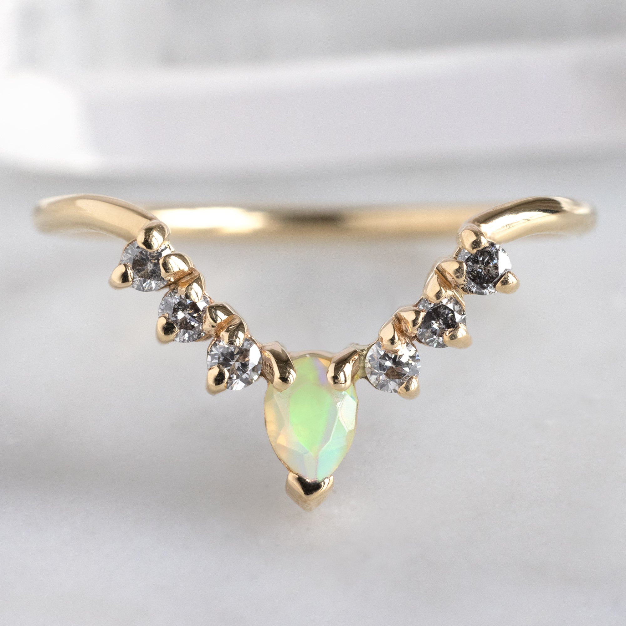 One of a Kind Opal and Salt and Pepper Diamond Sunburst Stacking Band in 14K Gold on White Marble