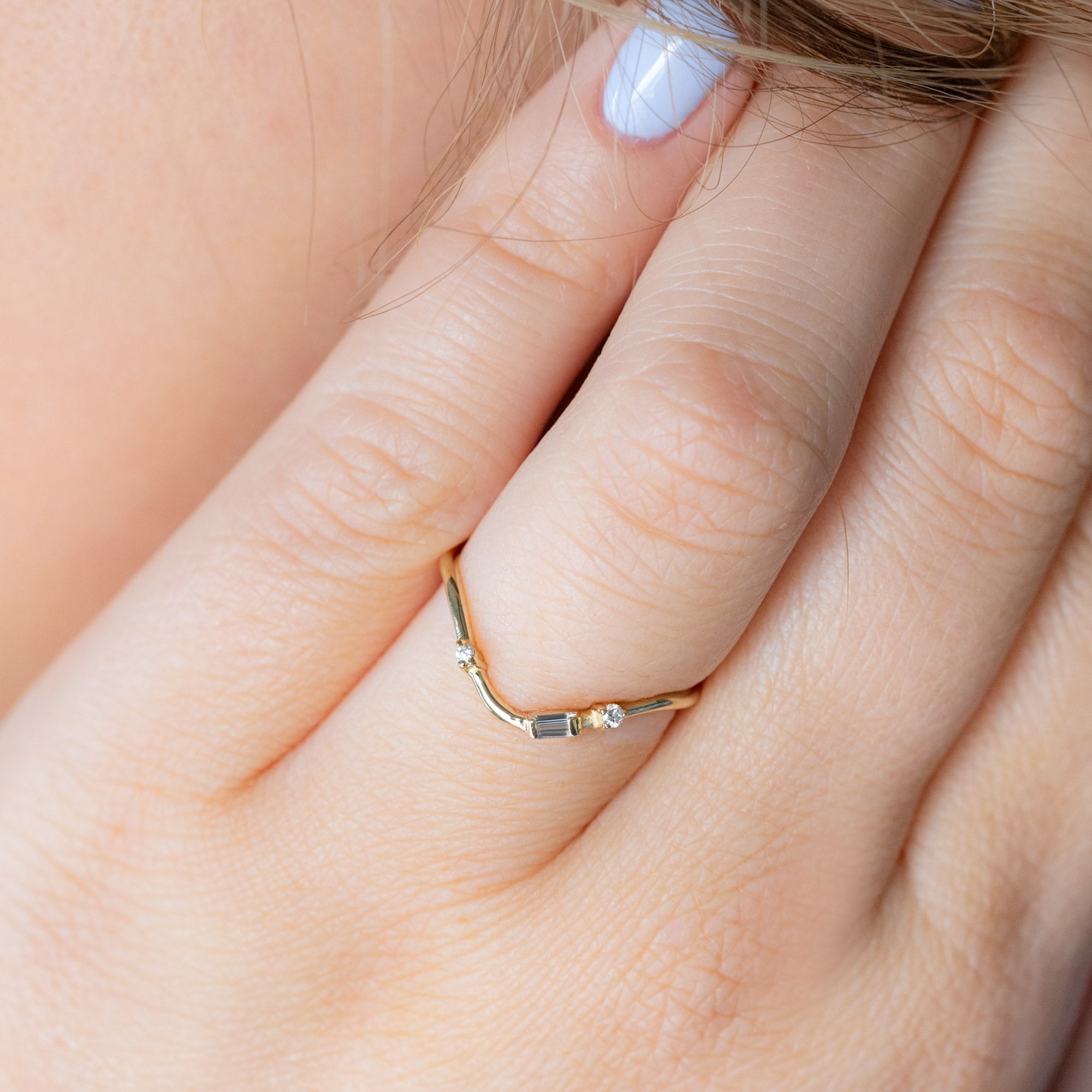 Asymmetrical Baguette Diamond Arc Stacking Band in 14K Yellow Gold worn solo on model