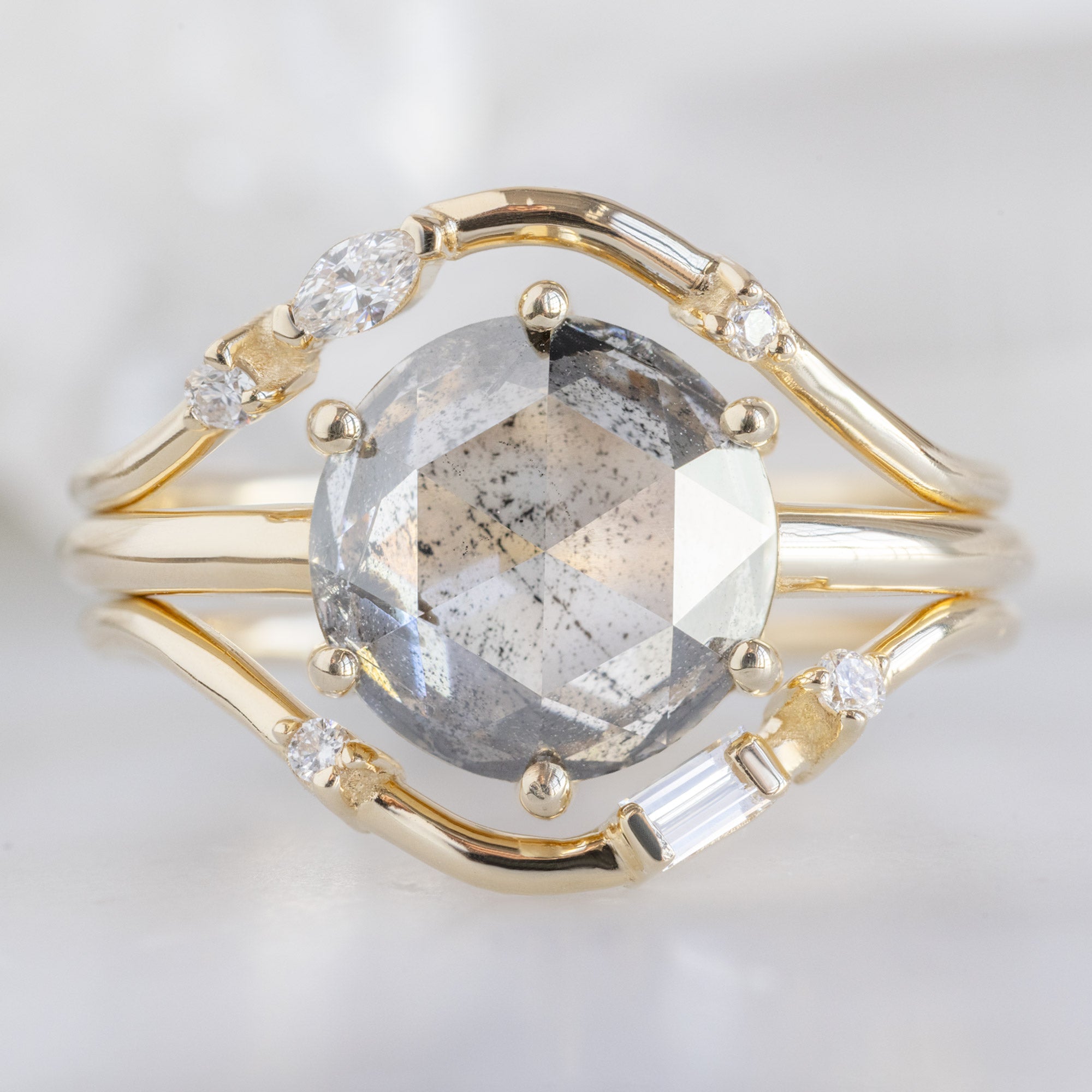 Asymmetrical Baguette Diamond Arc Stacking Band in 14K Yellow Gold Stacked with a Round Diamond Engagement Ring
