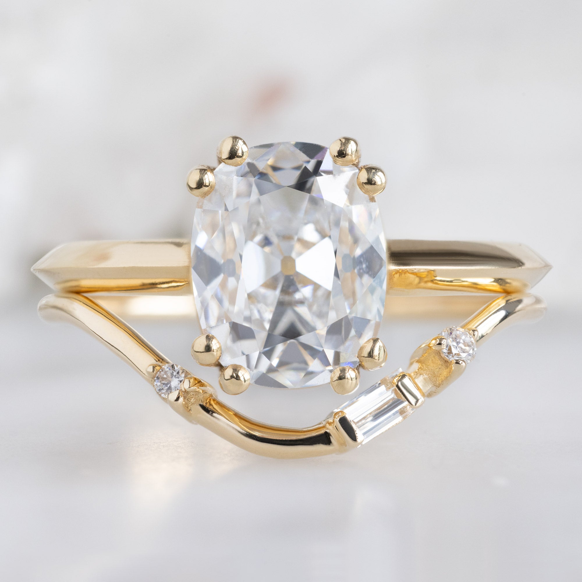 Asymmetrical Baguette Diamond Arc Stacking Band in 14K Yellow Gold Stacked with an Old Mine Cut Diamond Engagement Ring