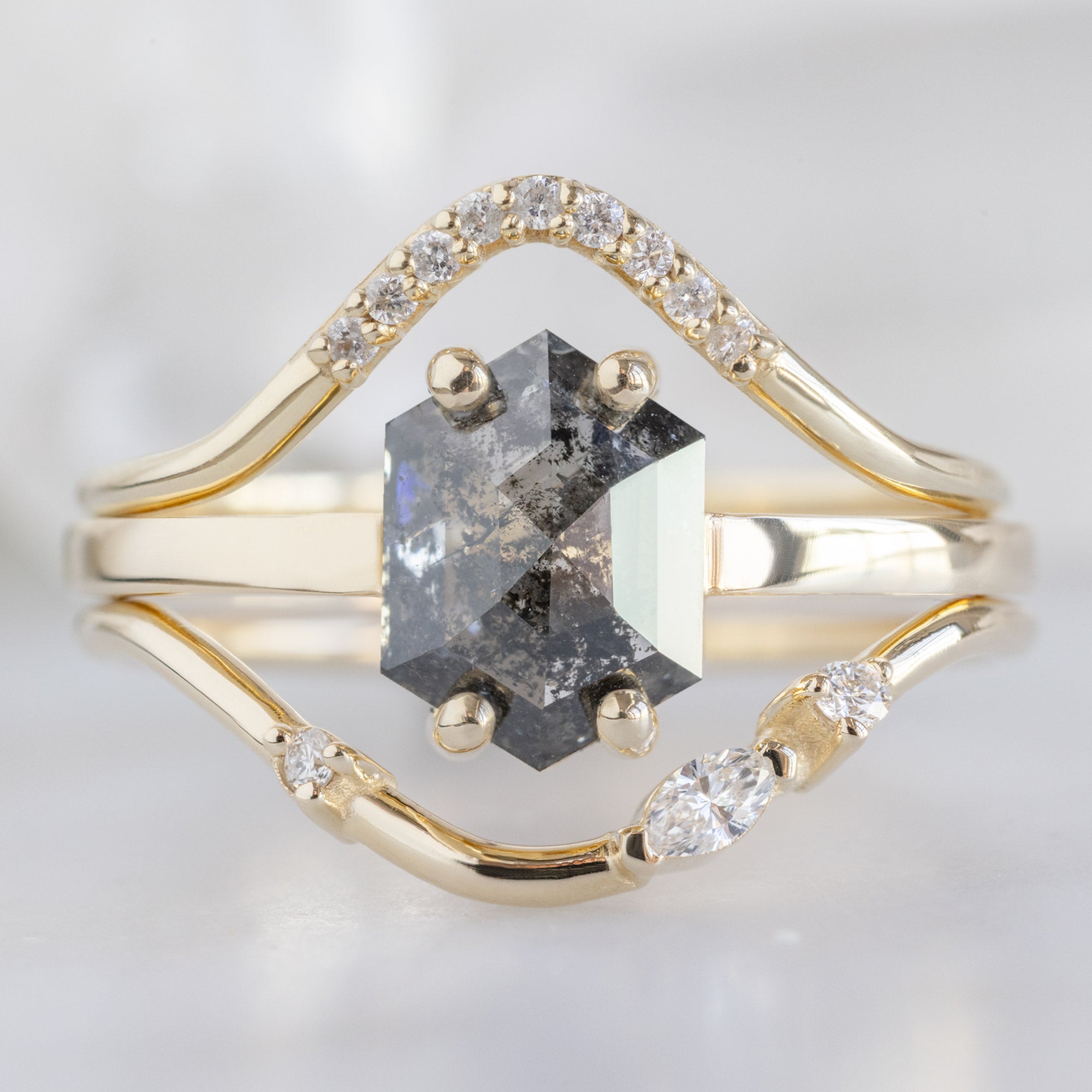 Asymmetrical Marquise Diamond Arc Stacking Band in 14K Yellow Gold Stacked with a Salt and Pepper Diamond Hexagon Engagement Ring