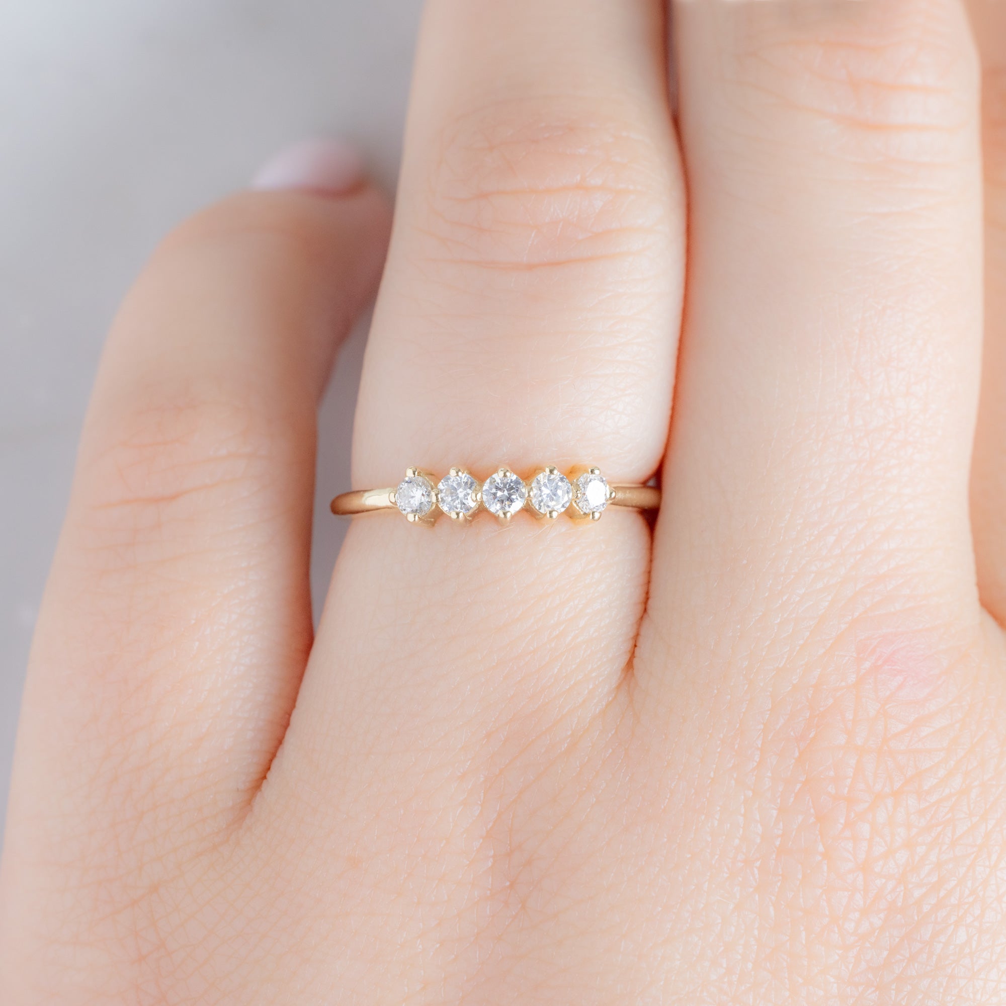 The Sequent White Diamond Wedding Band in 14K Yellow Gold on Model