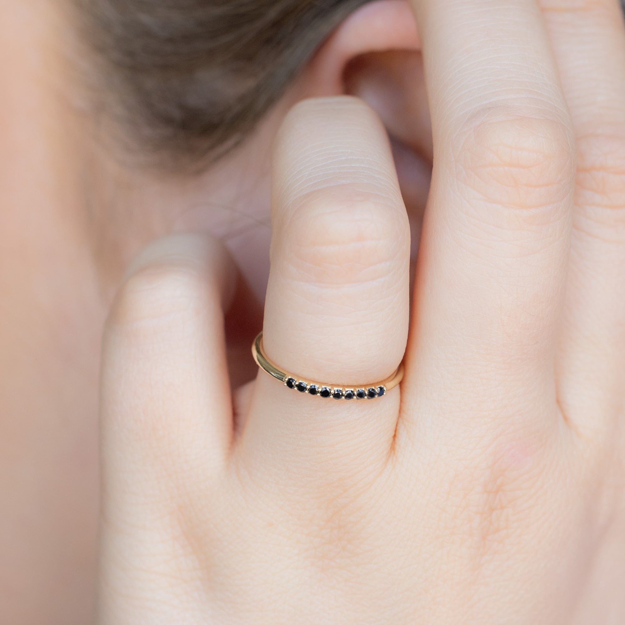 The Luxe Black Diamond Pavé Wedding Band in 14K Yellow Gold on Model