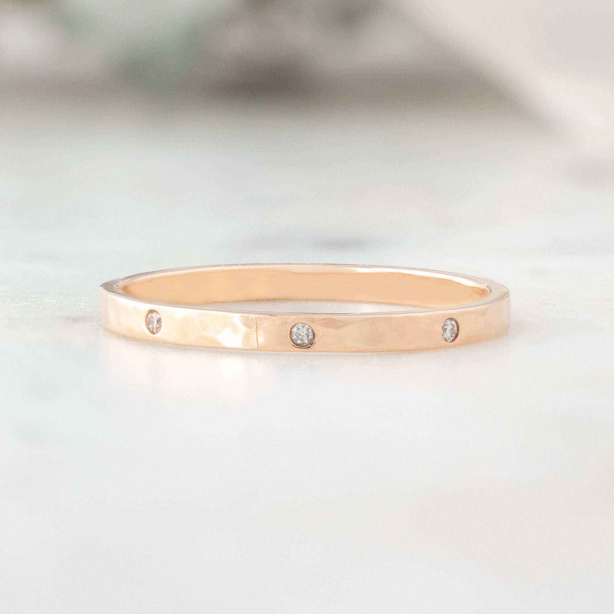 Salt and Pepper Diamond Eternity Band in 14K Rose Gold on White Marble