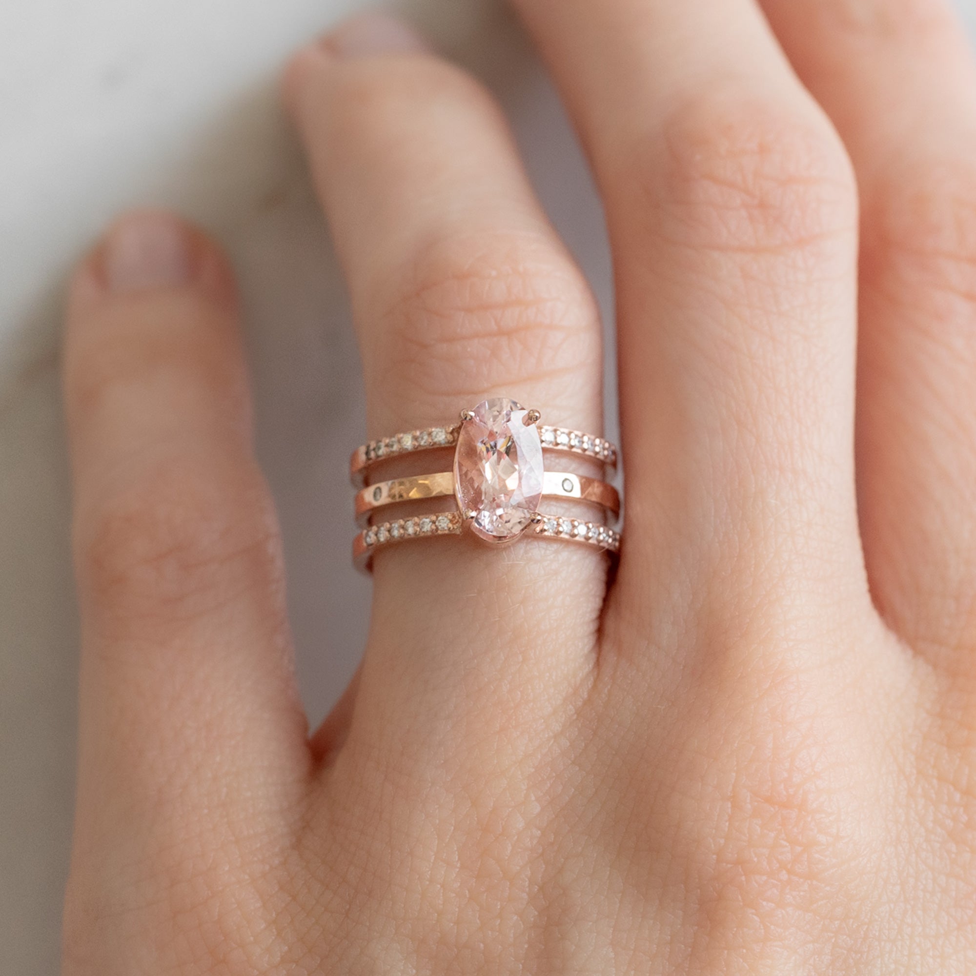 Salt and Pepper Diamond Eternity Band in 14K Yellow Gold Stacked with Oval Morganite Double Band Engagement Ring on Model