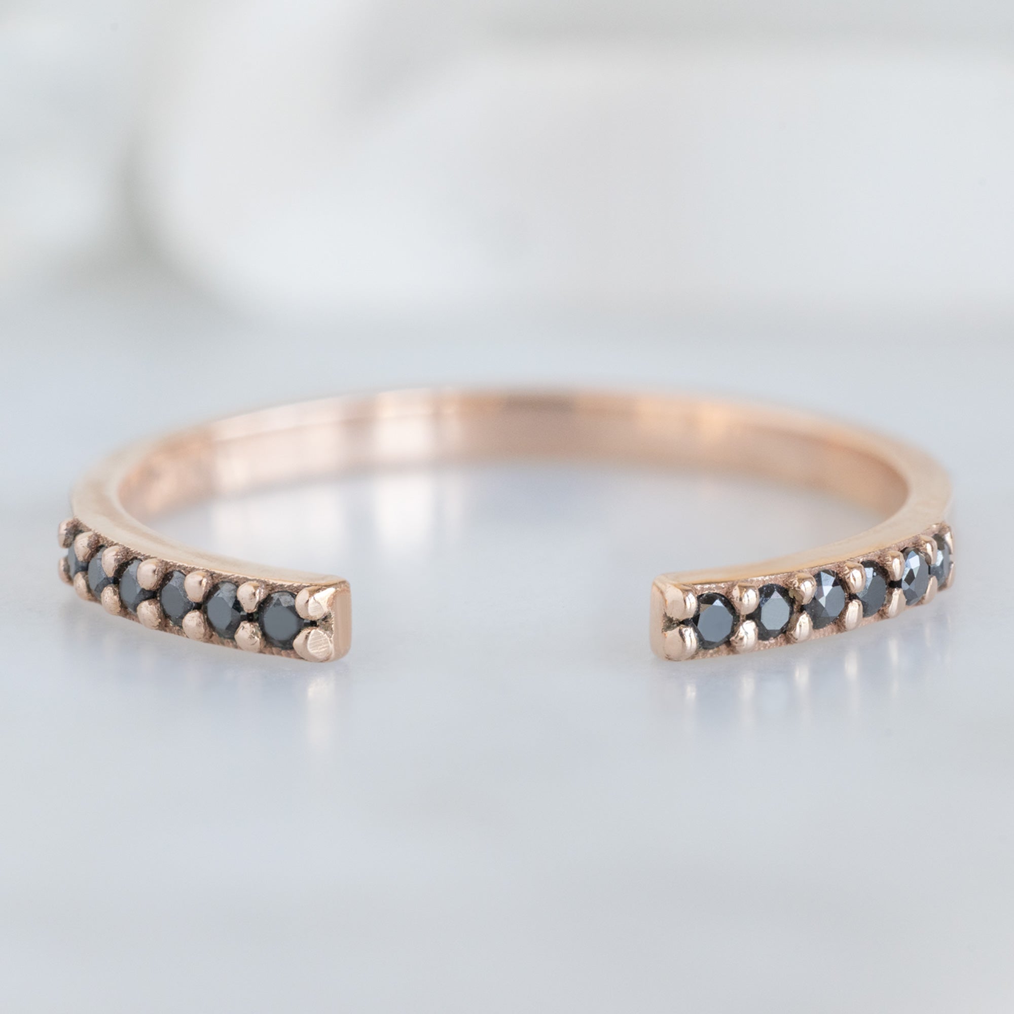 Open Cuff Black Diamond Pavé Stacking Band in 14K Rose Gold on White Marble