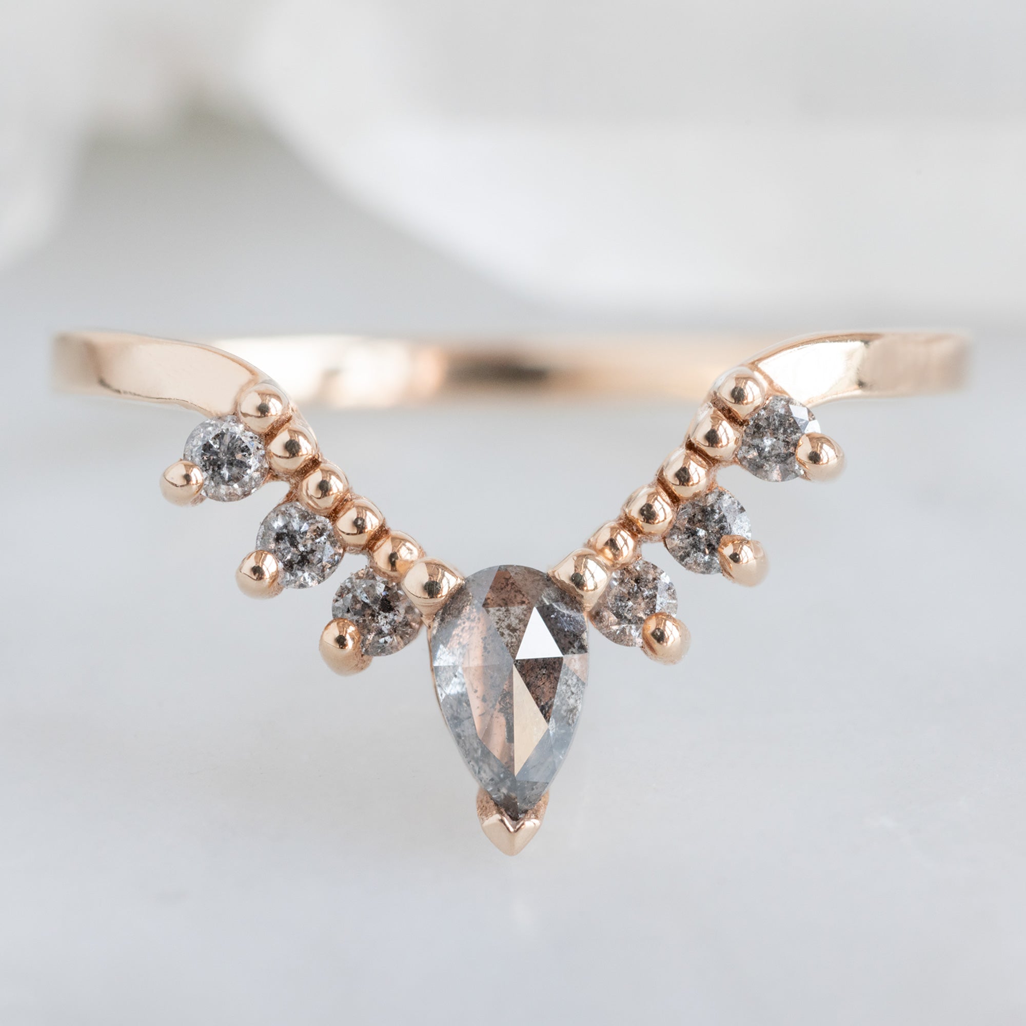Salt and Pepper Diamond Sunburst Stacking Band in 14K Rose Gold on White Marble