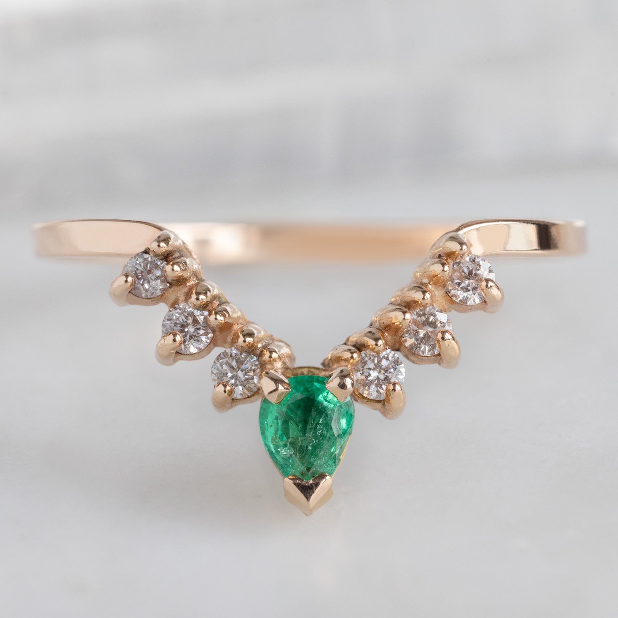 One of a Kind Emerald and White Diamond Sunburst Stacking Band in 14K Rose Gold on White Marble