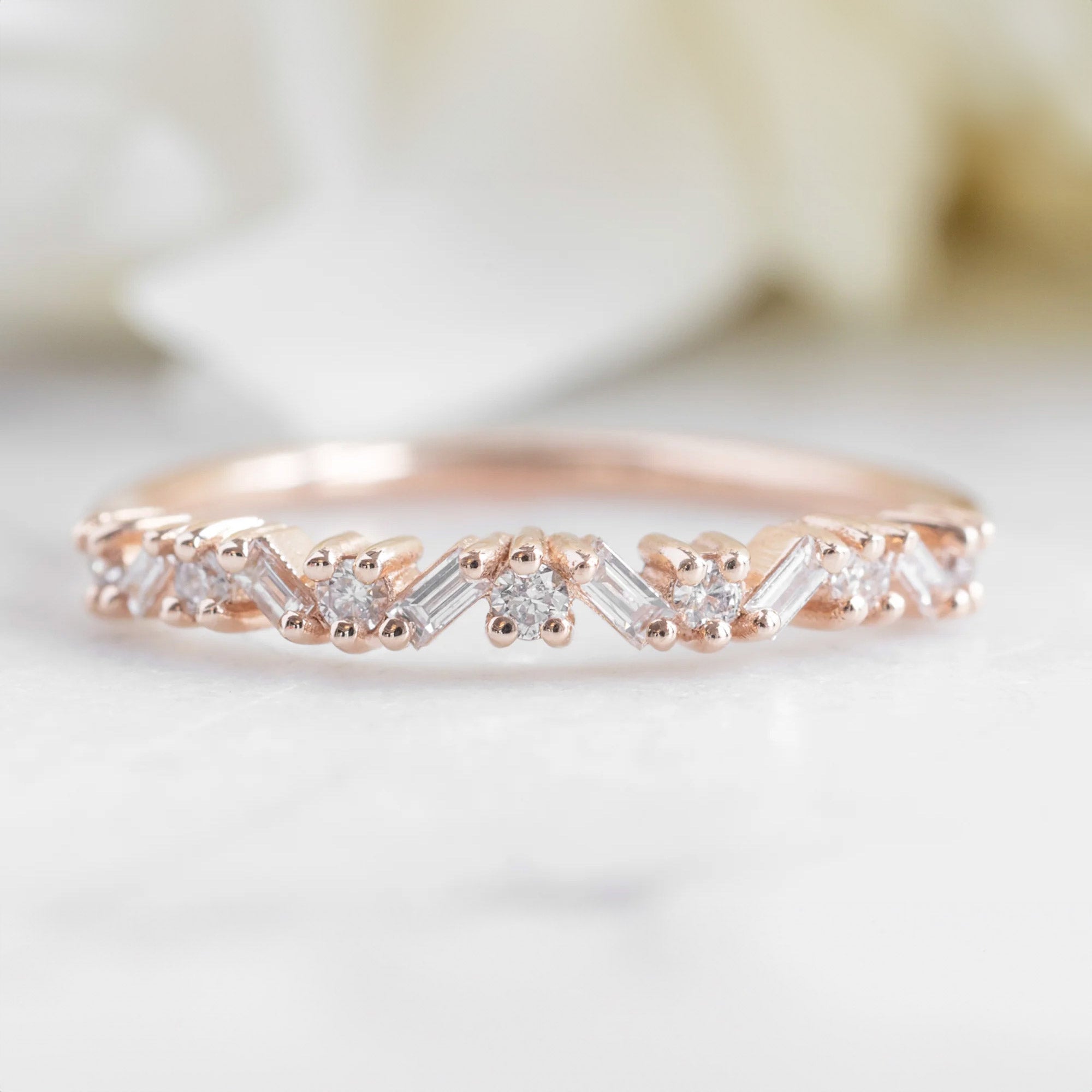 The Baguette Confetti Stacking Ring In 14k Rose Gold Gold on Marble Surface