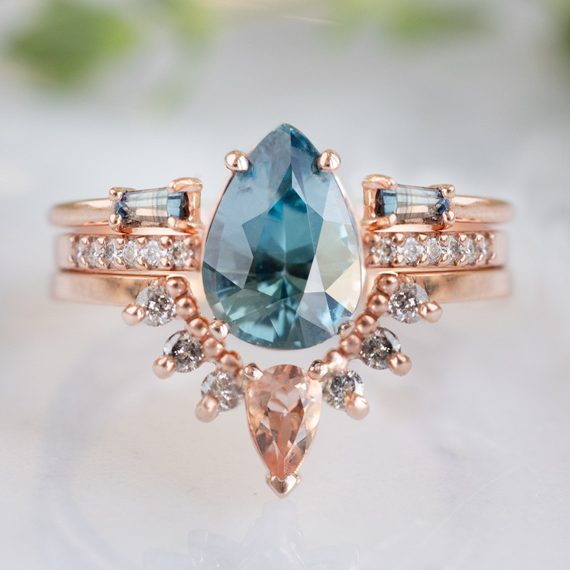 One of a Kind Sunstone and Salt and Pepper Diamond Sunburst Stacking Band in 14K Rose Gold Stacked with Sapphire Pear Gemstone Engagement Ring