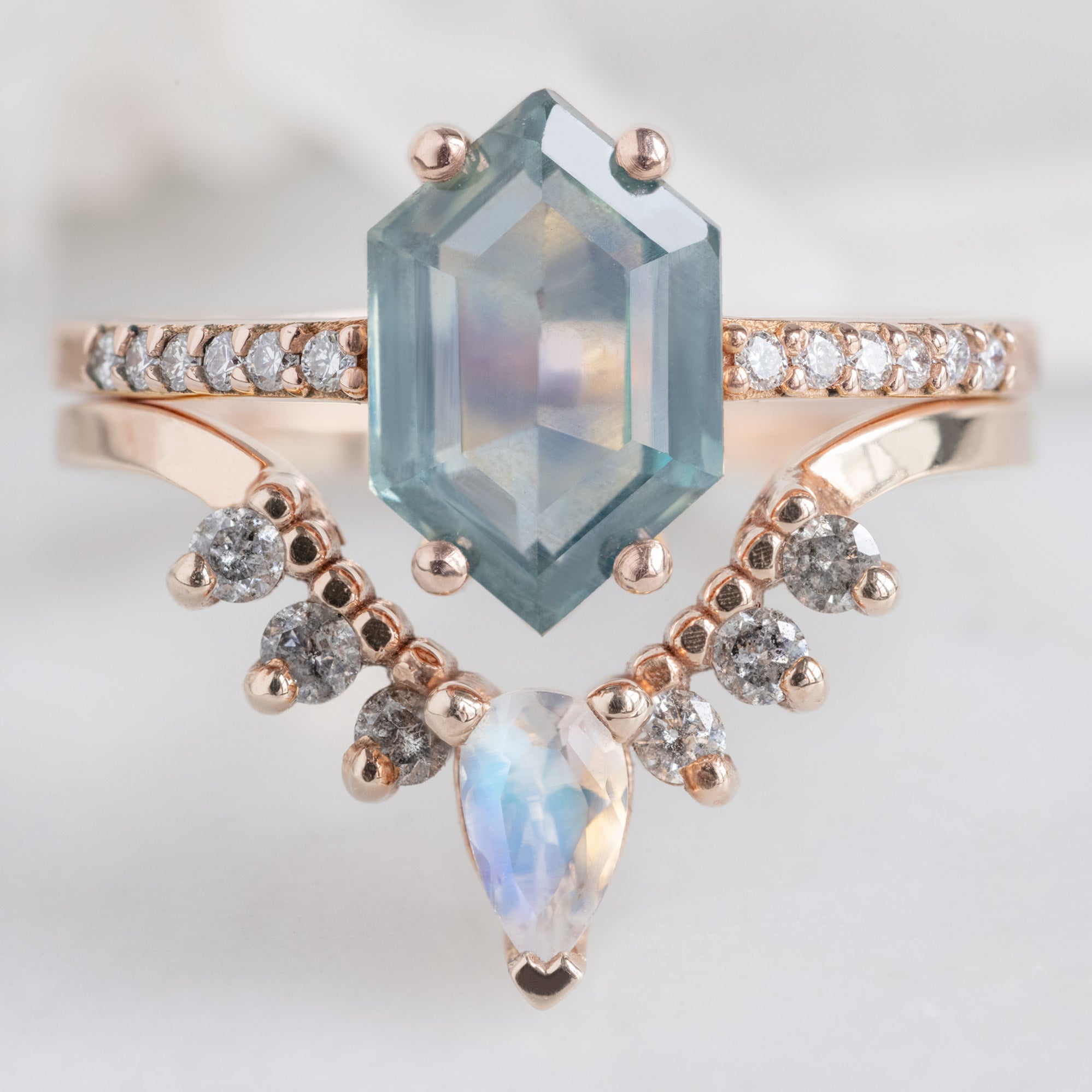Moonstone and Salt and Pepper Diamond Sunburst Stacking Band in 14K Rose Gold Stacked with a Sapphire Hexagon Engagement Ring