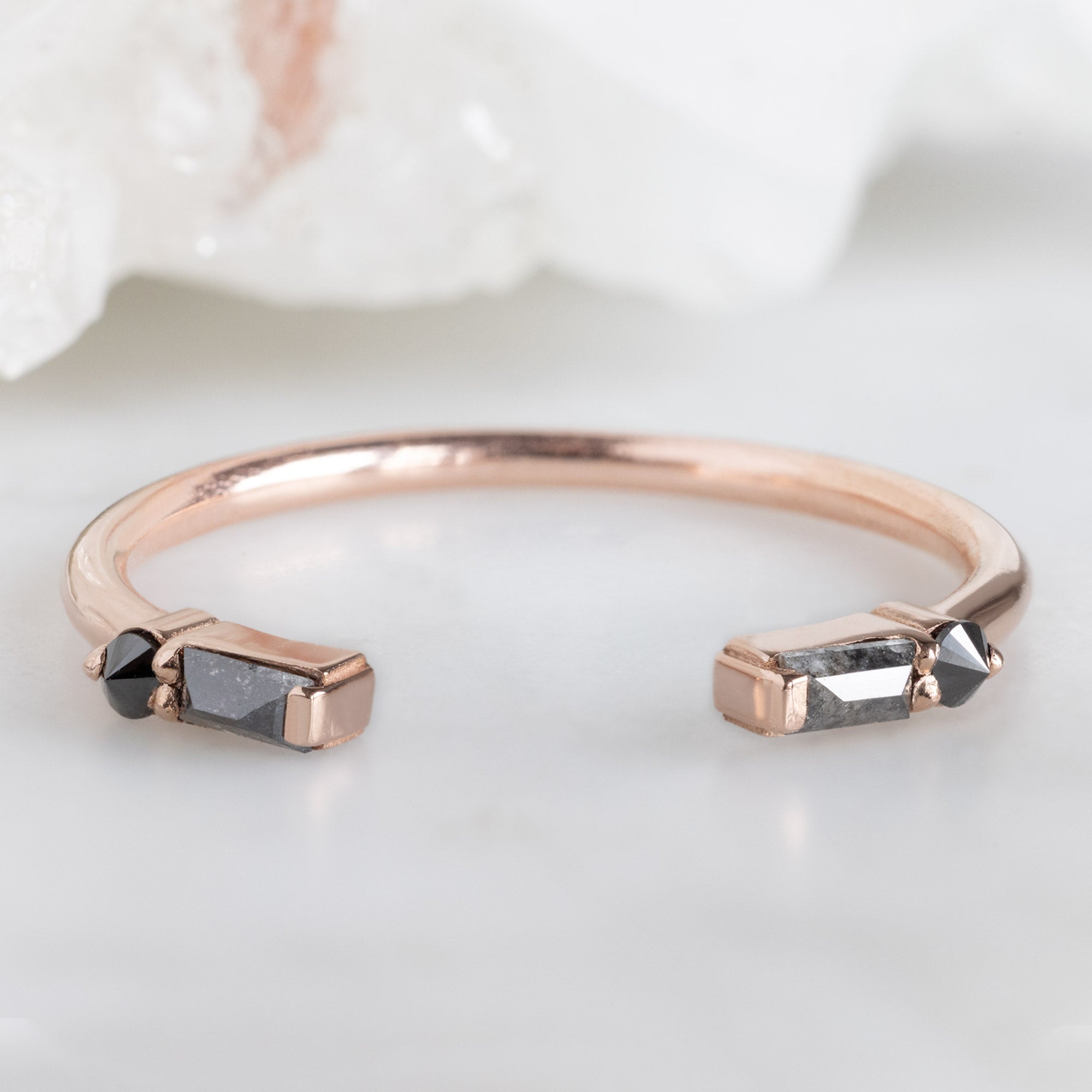 The Luxe Open Cuff Black Baguette Diamond Stacking Band in 14K Rose Gold on White Marble