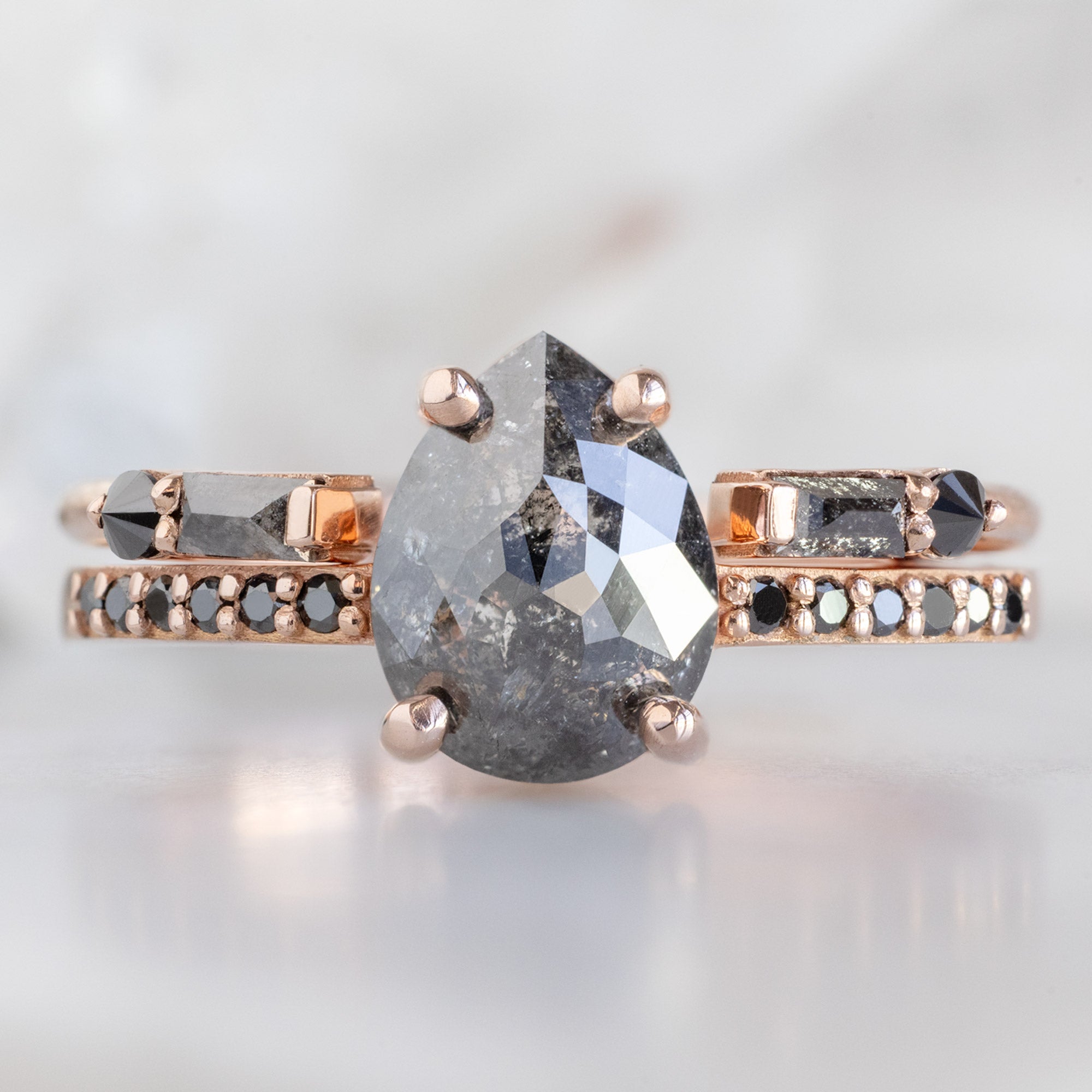 The Luxe Open Cuff Black Baguette Diamond Stacking Band in 14K Rose Gold stacked with diamond engagement ring