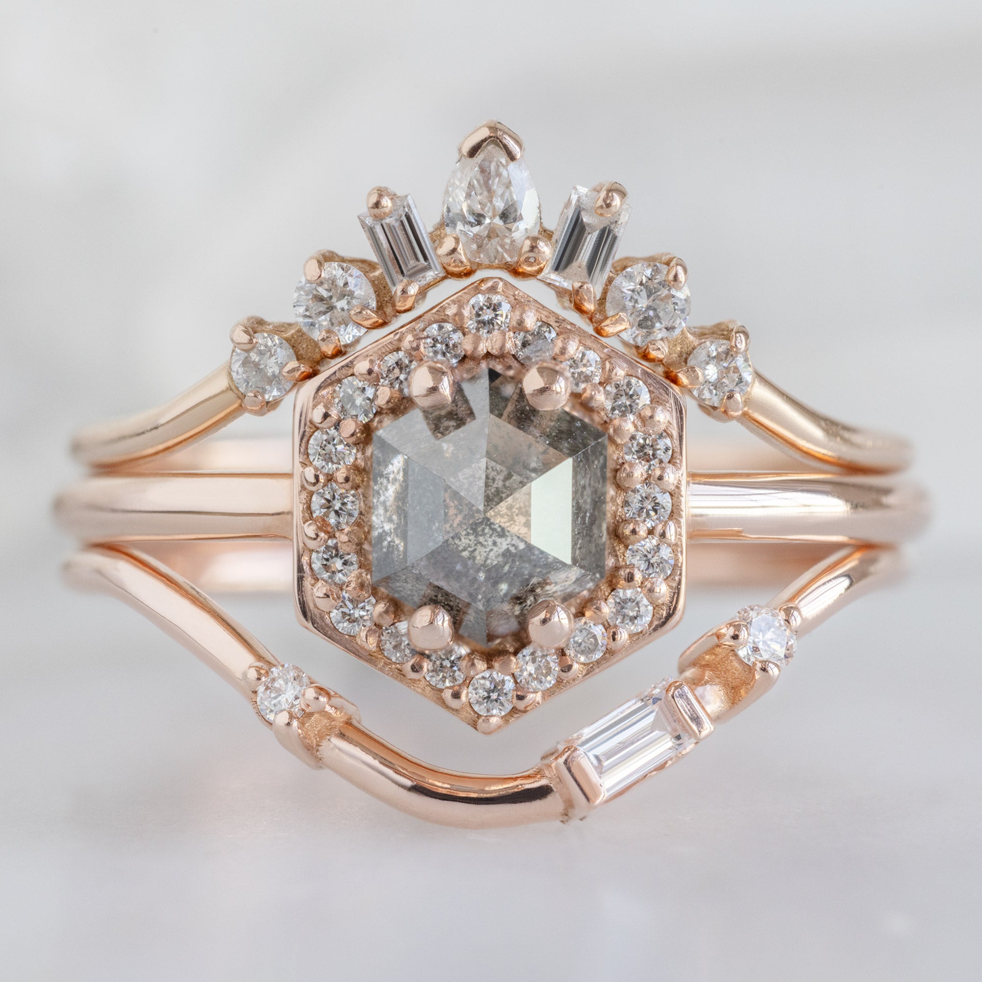Asymmetrical Baguette Diamond Arc Stacking Band in 14K Rose Gold Stacked with a Salt and Pepper Hexagon Diamond Engagement Ring