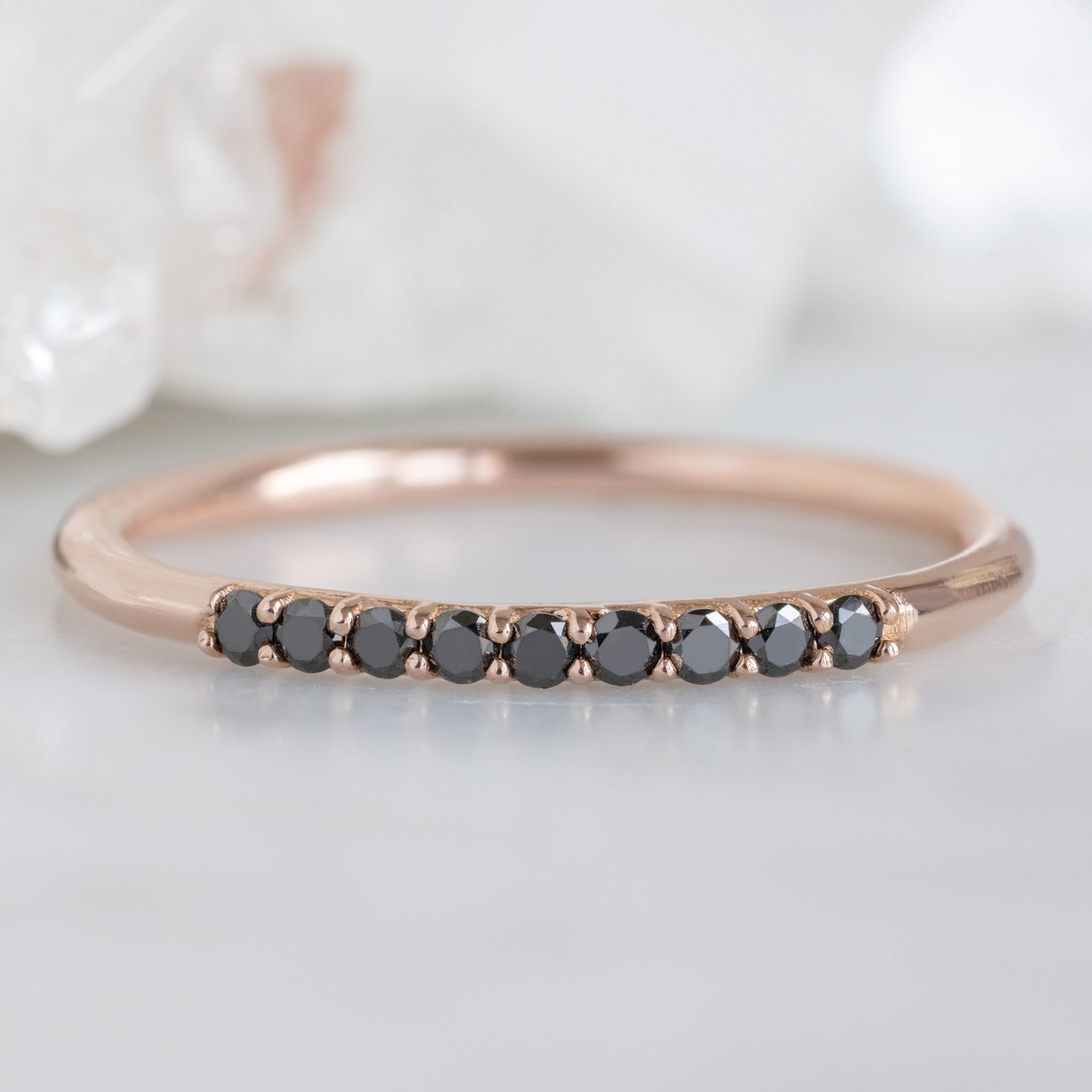 The Luxe Black Diamond Pavé Wedding Band in 14K Rose Gold on White Marble