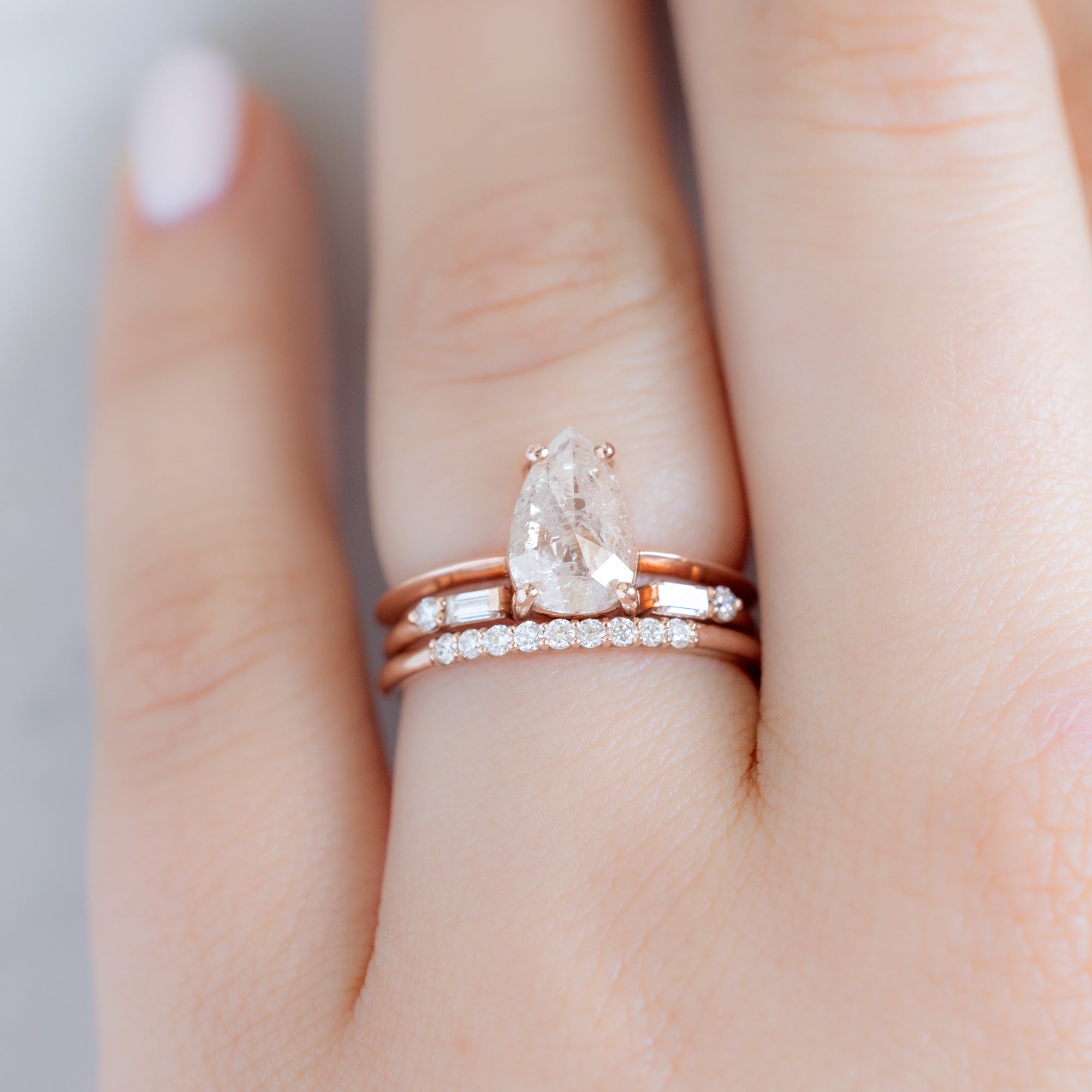 The Luxe White Diamond Pavé Wedding Band in 14K Rose gold Stacked with White Diamond Engagement Ring on Model