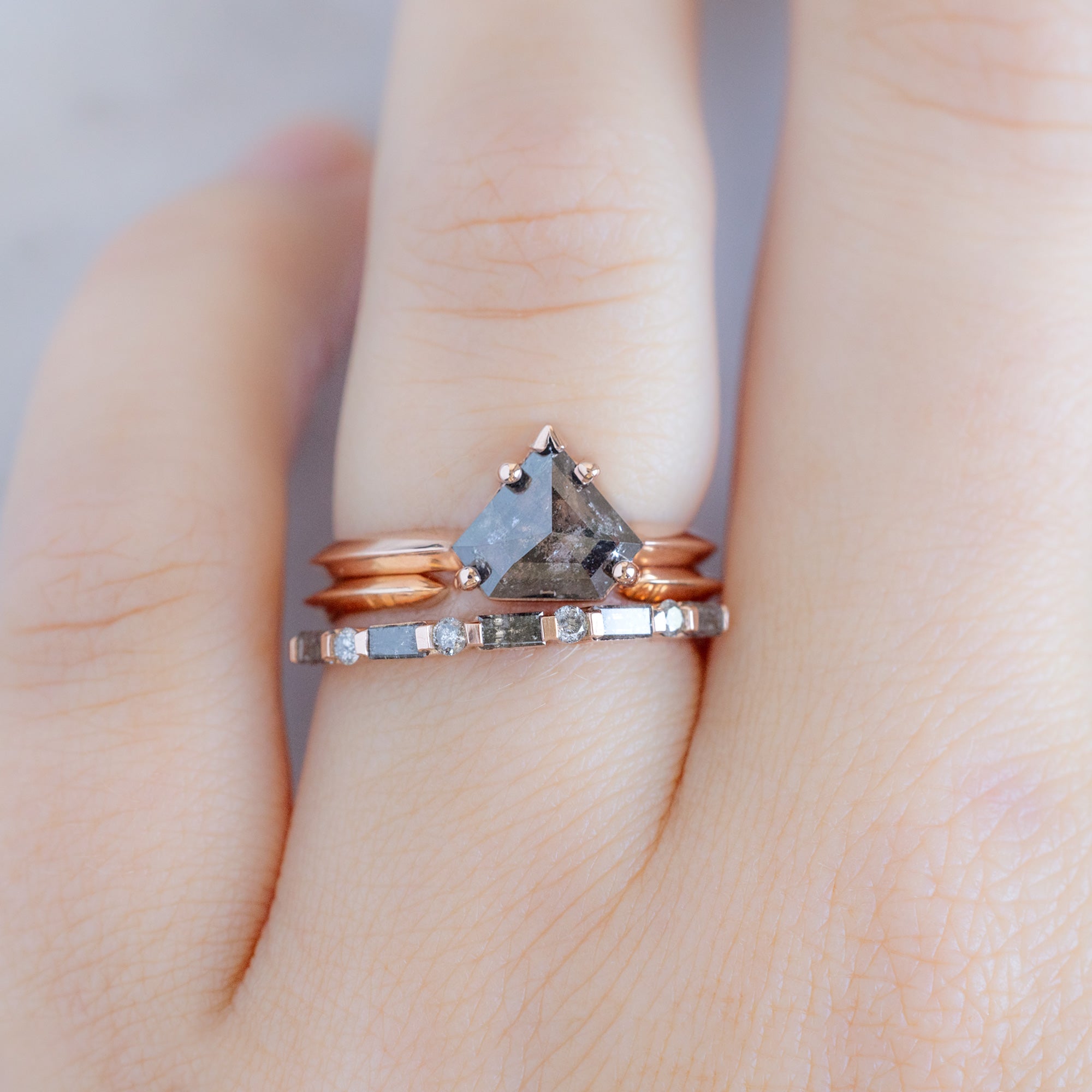 The Luxe Baguette Salt and Pepper Diamond Eternity Band in 14K Rose Gold  Stacked with a Black Diamond Engagement Ring on Model