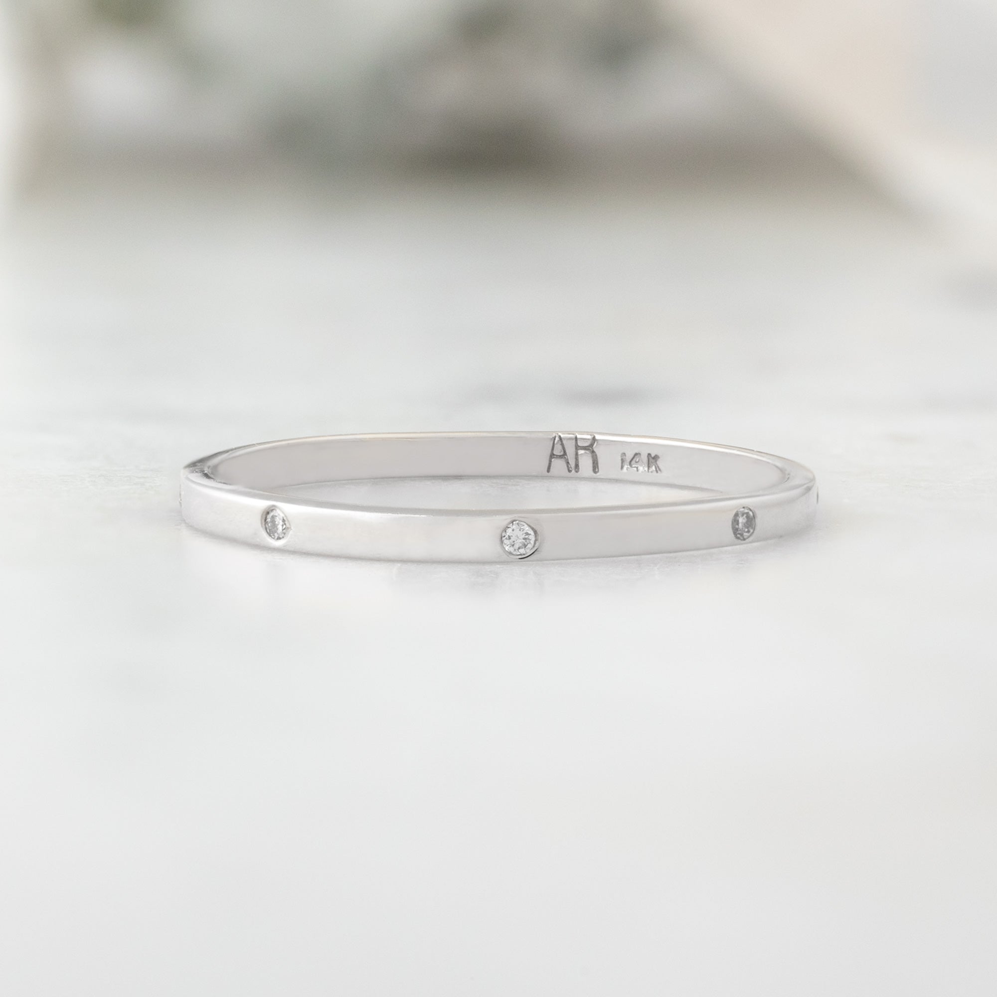 White Diamond Eternity Band in 14K White Gold on White Marble