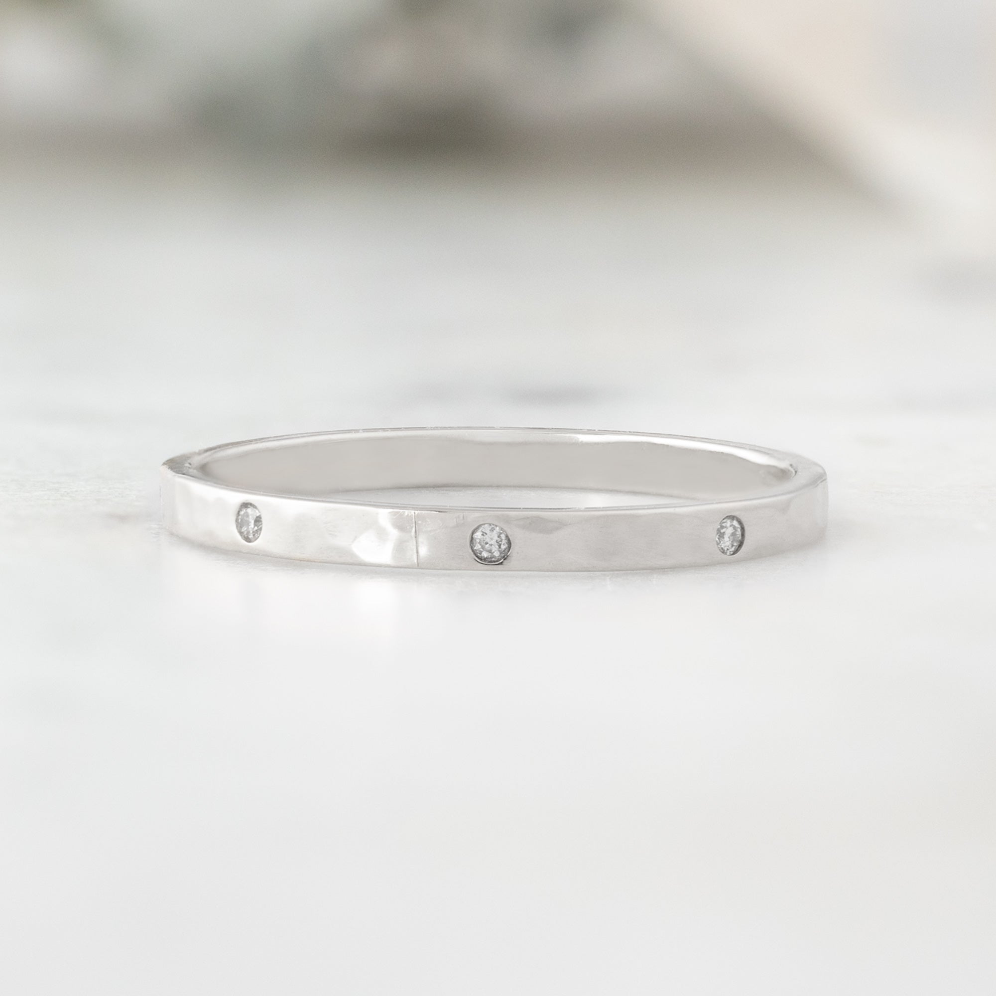 Salt and Pepper Diamond Eternity Band in 14K White Gold on White Marble