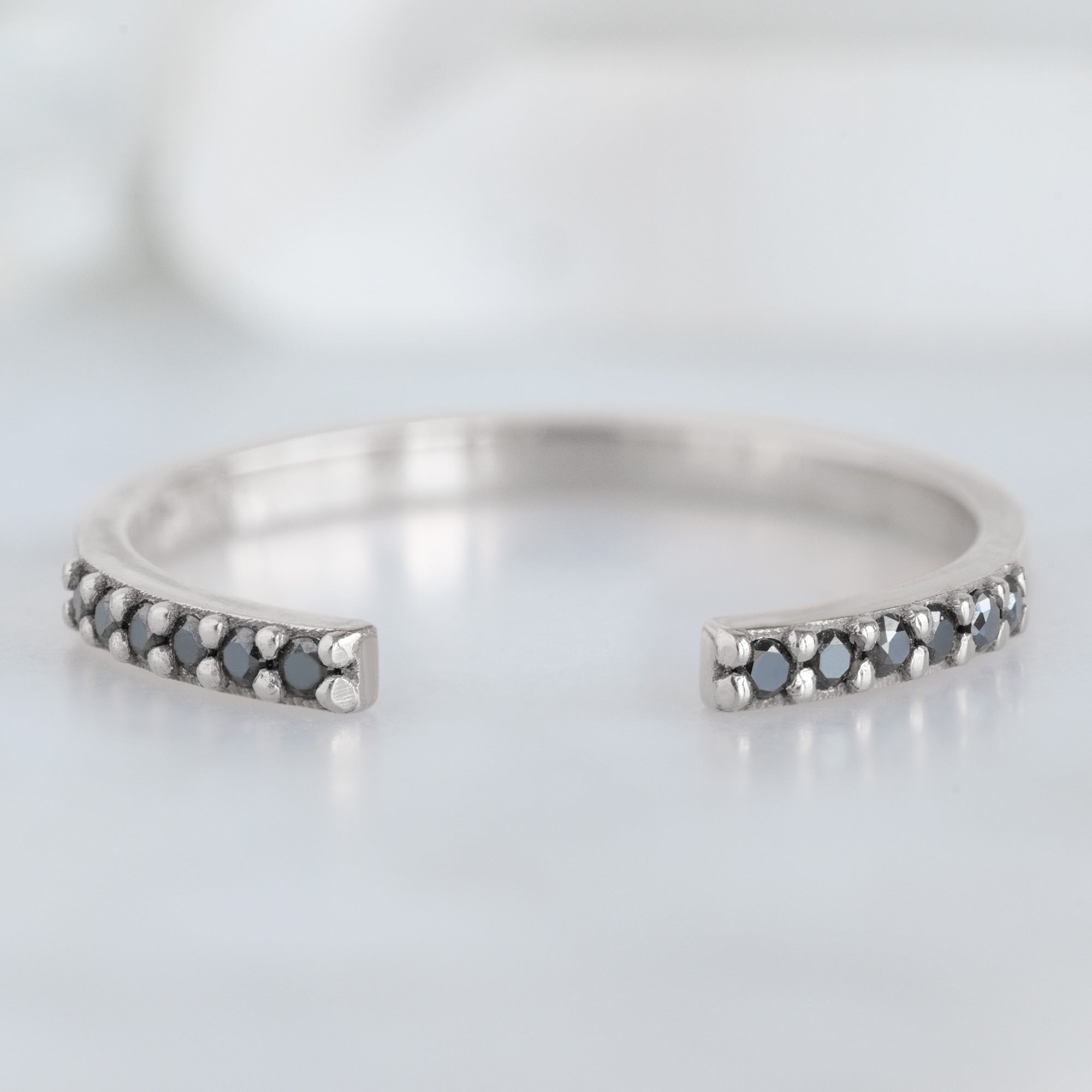Open Cuff Black Diamond Pavé Stacking Band in 14K White Gold on White Marble
