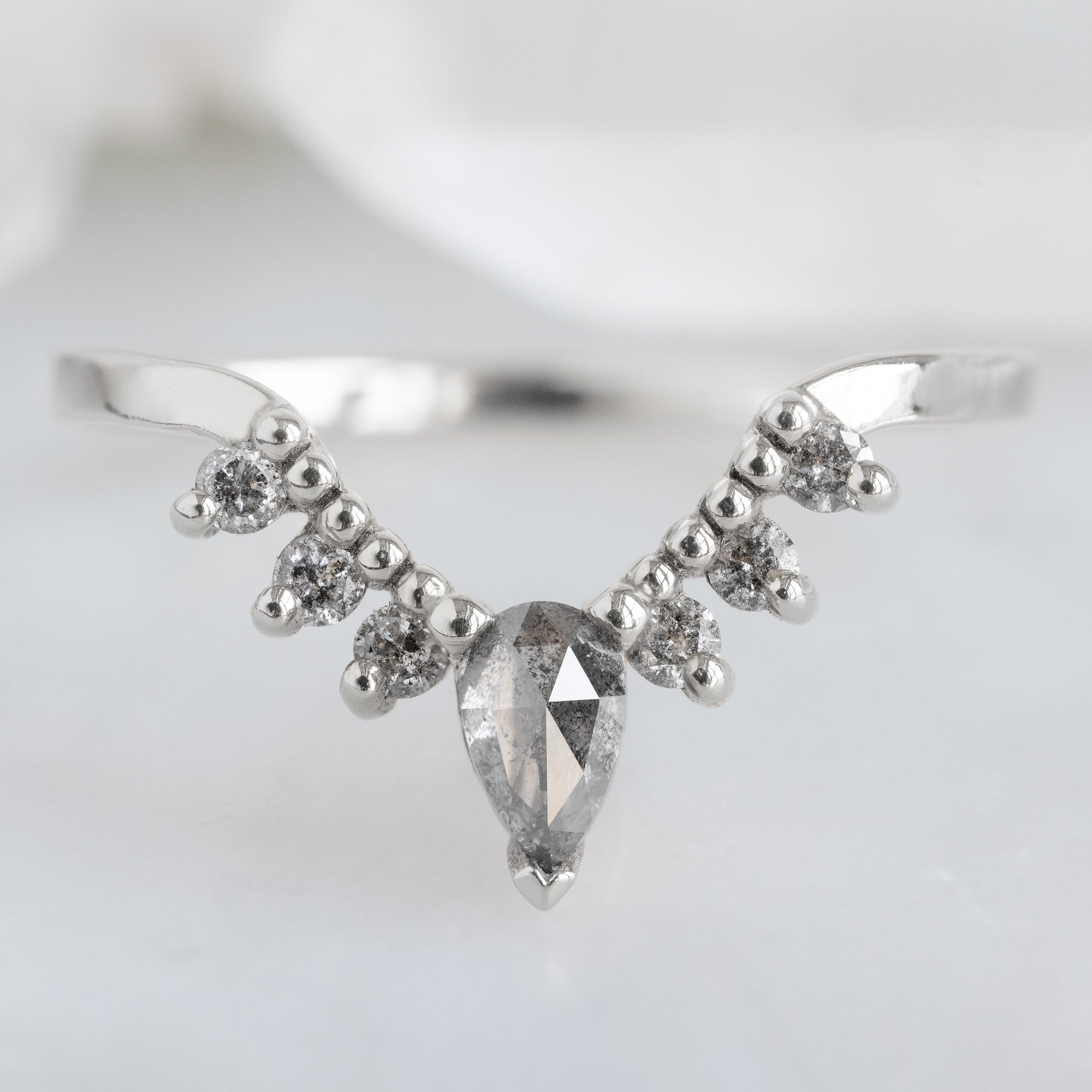 Salt and Pepper Diamond Sunburst Stacking Band in 14K White Gold on White Marble Tile