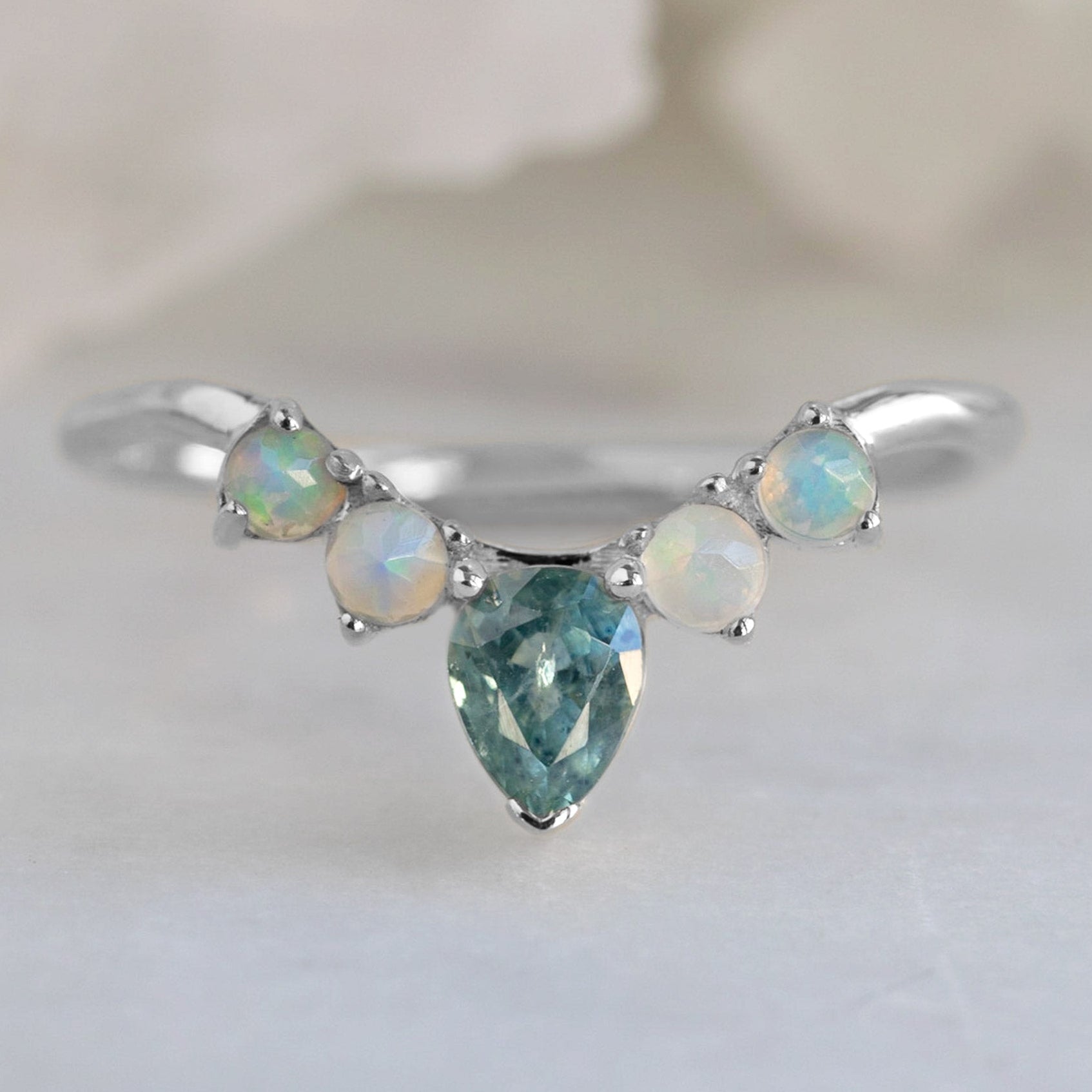 One of a Kind Montana Sapphire + Opal Sunburst Stacking Band in White Gold on White Marble Surface