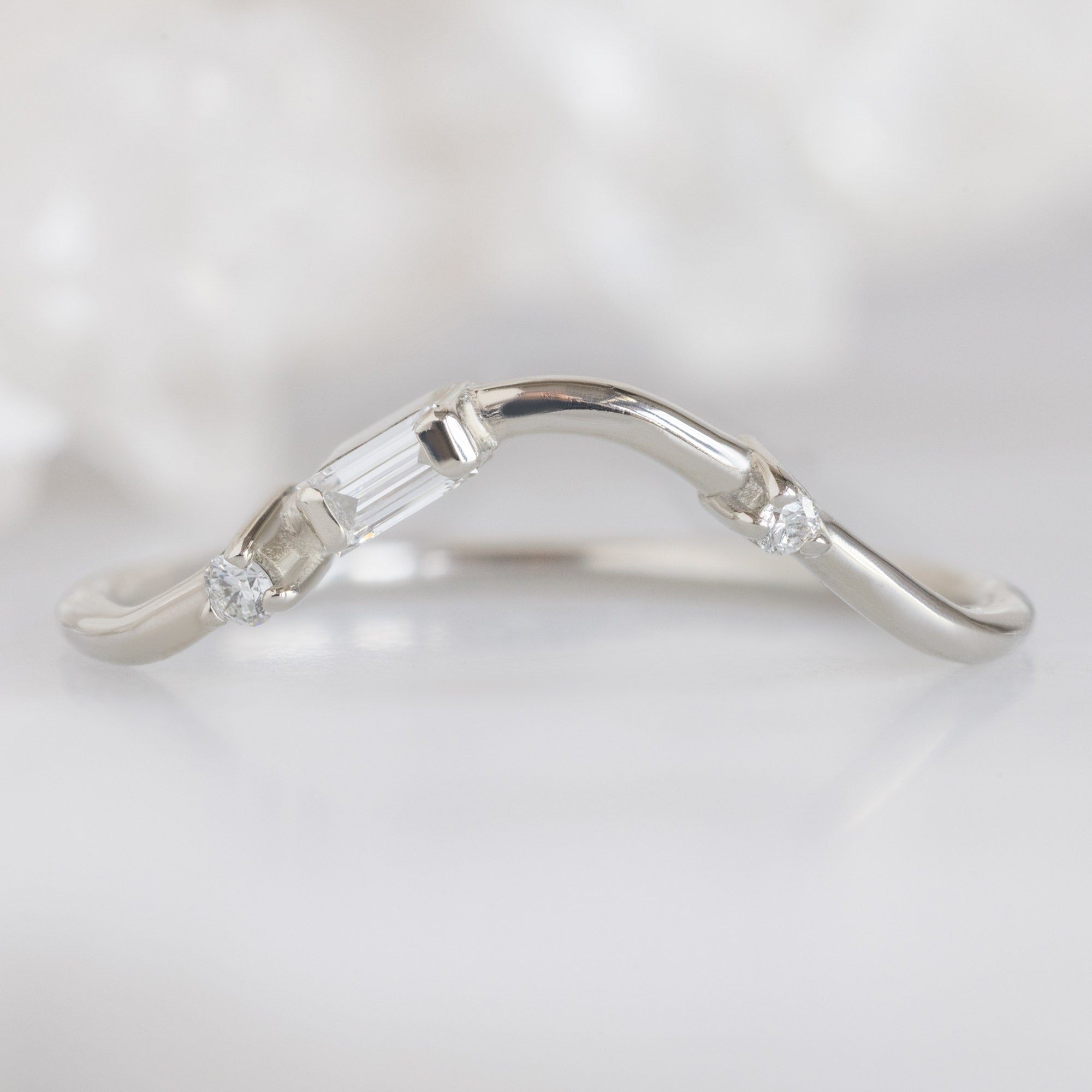 Asymmetrical Baguette Diamond Arc Stacking Band in 14K White Gold on White Marble